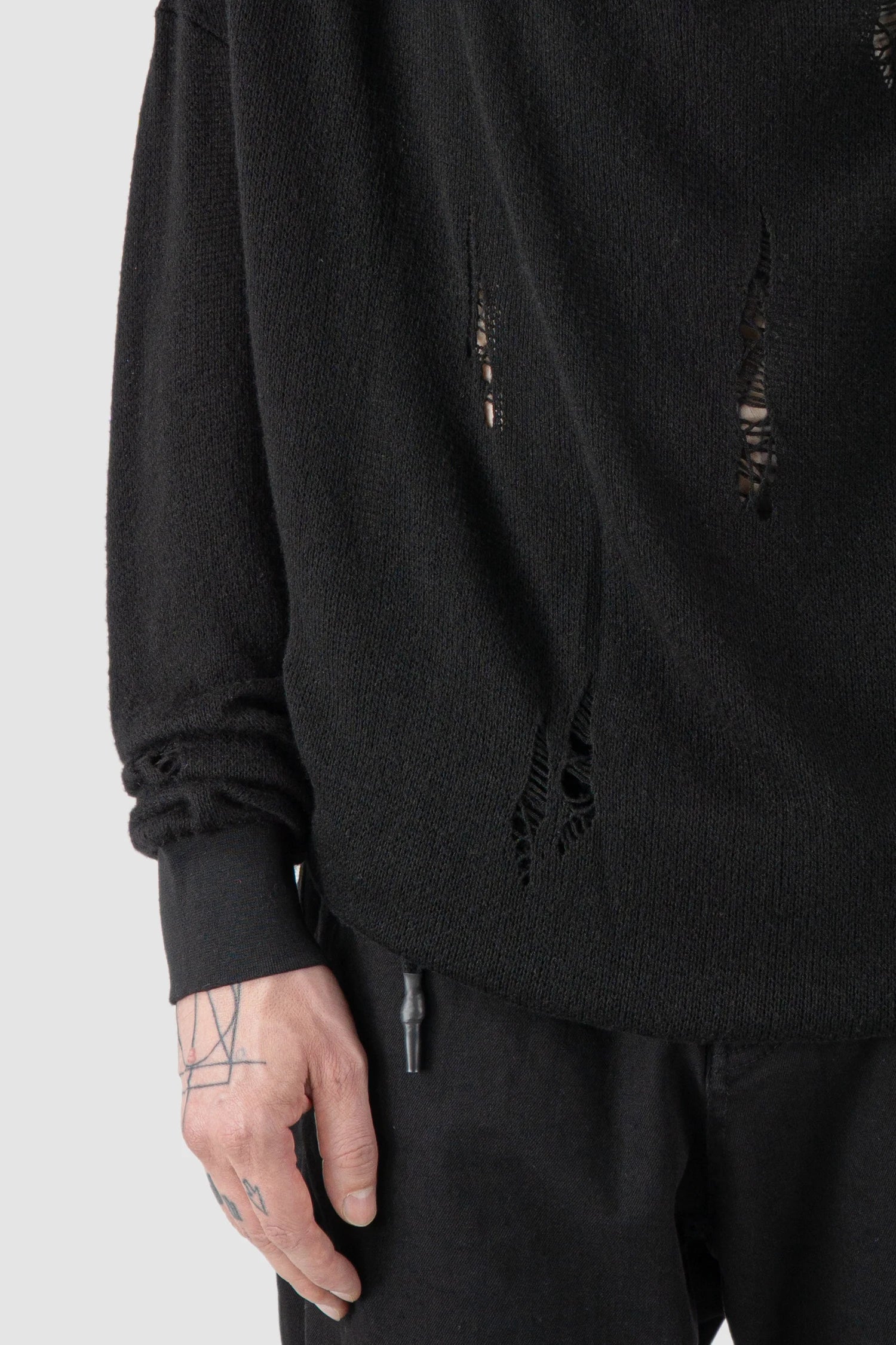 La Haine Inside Us - fabric detail view of men’s FW25 Black Destroyed Waterfall Draping Hooded Knit Sweater