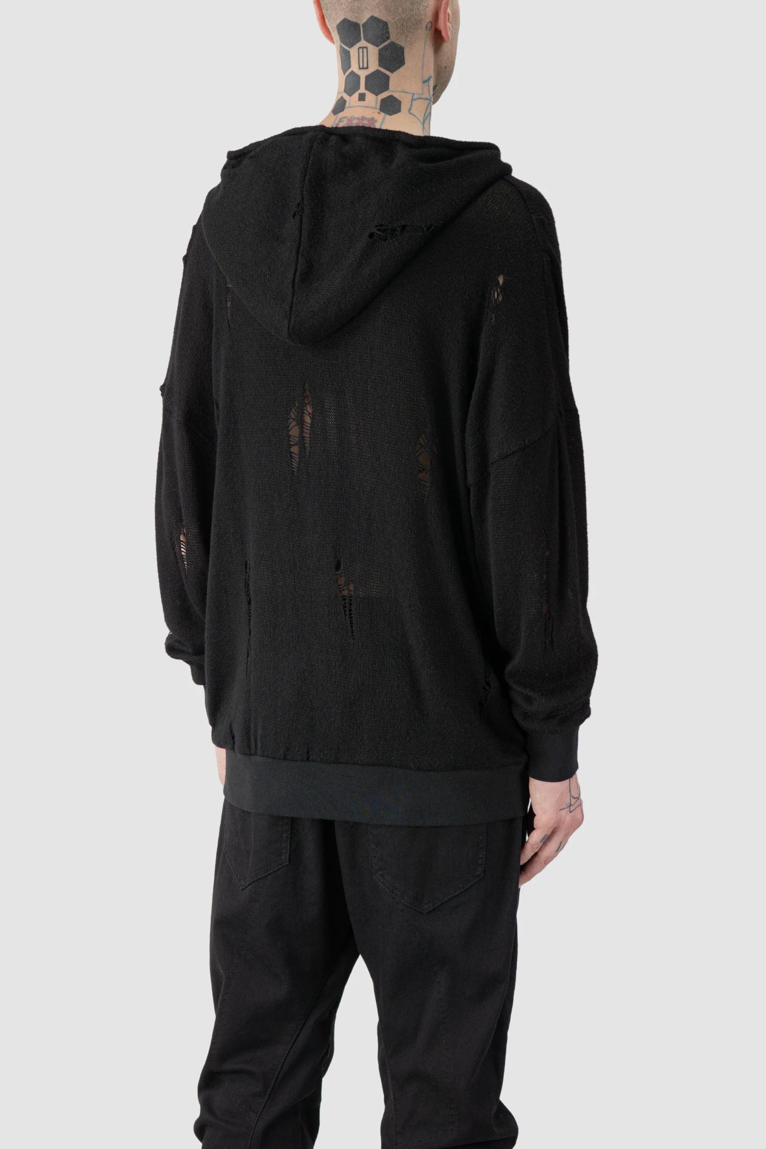 La Haine Inside Us - model back side view of men’s FW25 Black Destroyed Waterfall Draping Hooded Knit Sweater
