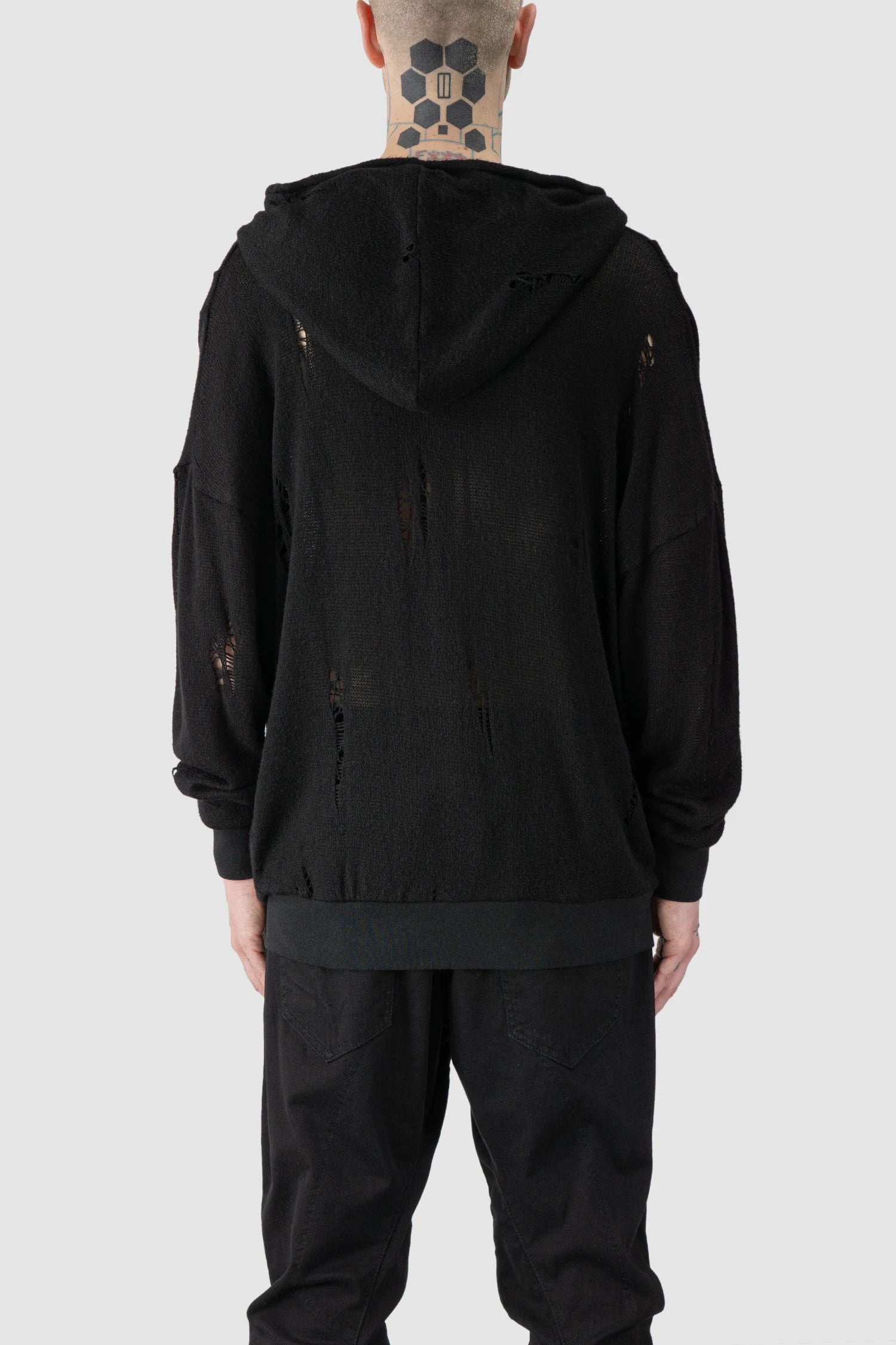 La Haine Inside Us - model back view of men’s FW25 Black Destroyed Waterfall Draping Hooded Knit Sweater
