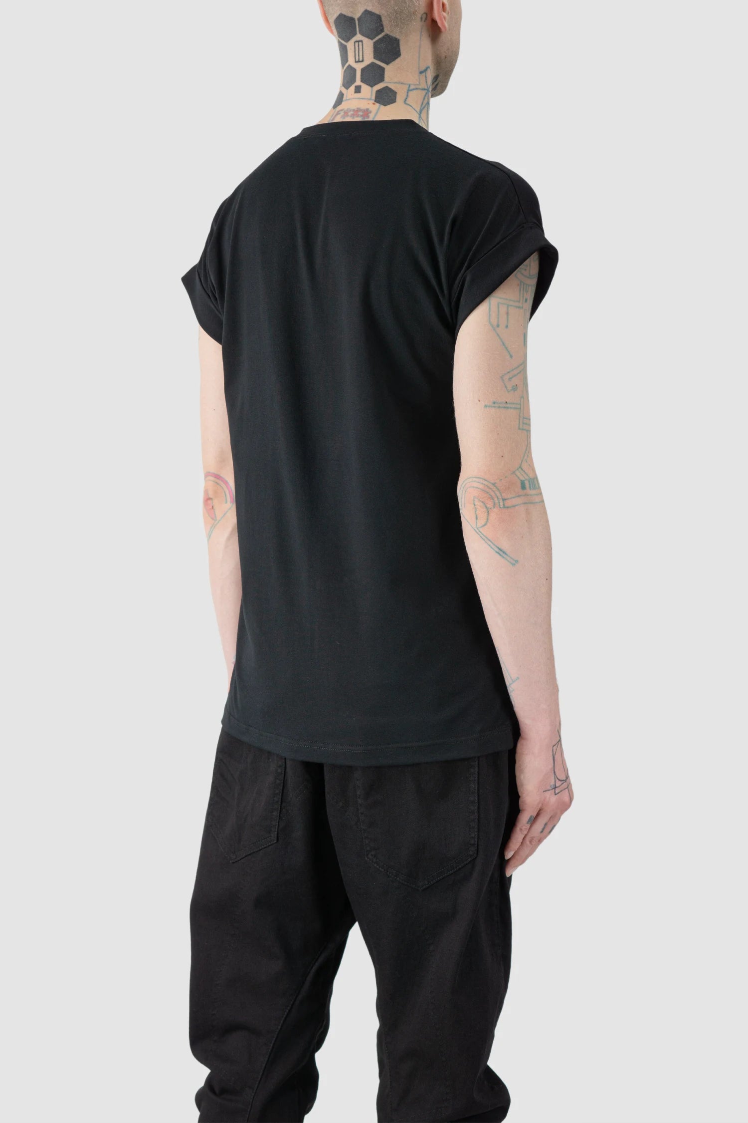 La Haine Inside Us - model back side view of men’s FW25 Black Front Seam Elastic Cotton T-Shirt