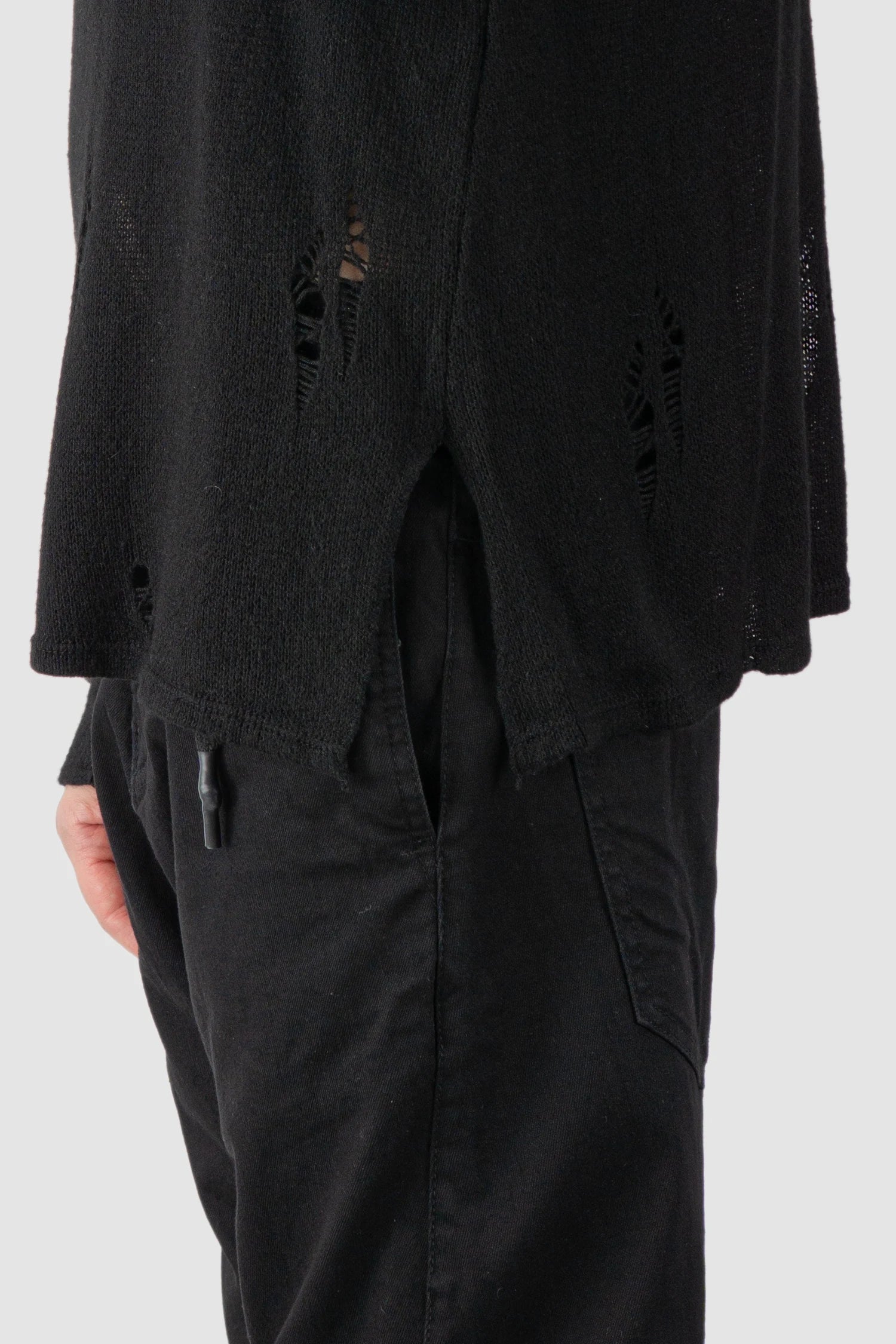 La Haine Inside Us - hem detail view of men’s FW25 Black Irregular Destroyed Viscose Blend Knit Sweatshirt