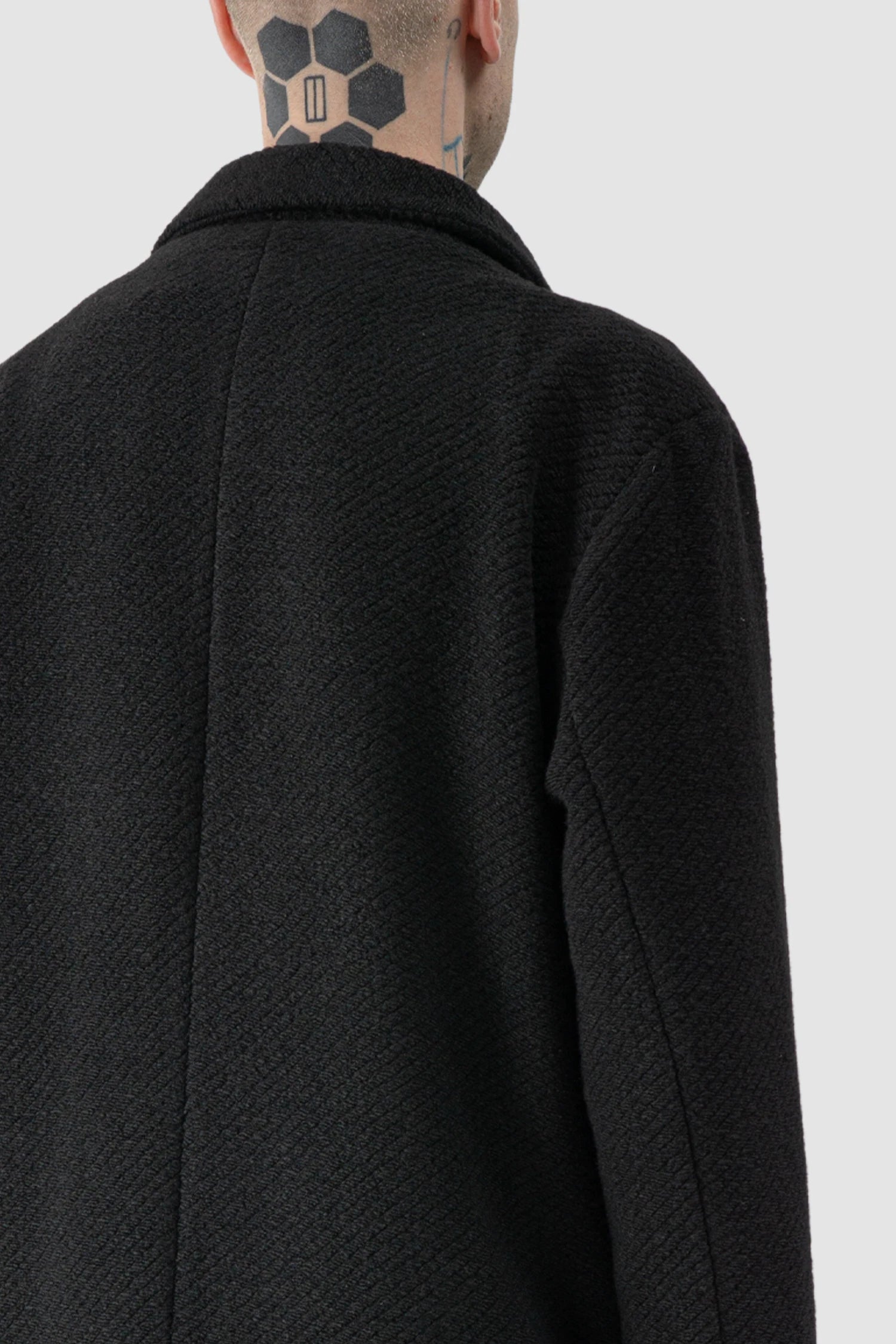 La Haine Inside Us - fabric detail view of men’s FW25 Black Long Wool Blend Coat with 2-Button Closure