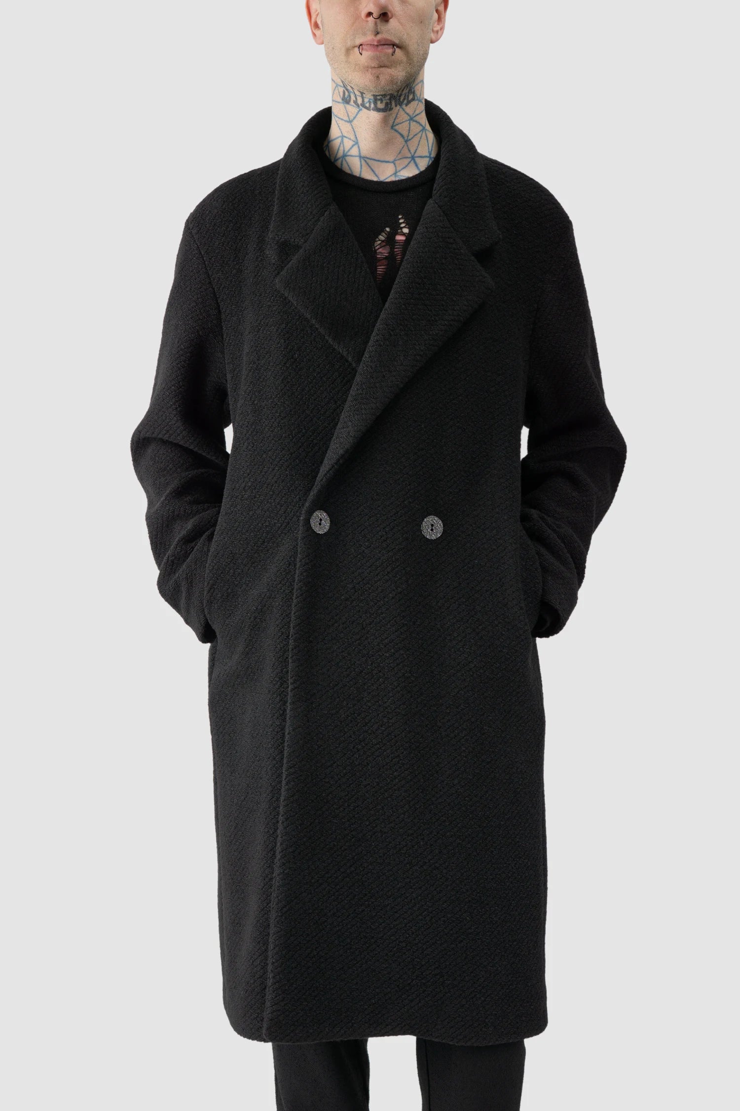 La Haine Inside Us - model front relaxed view of men’s FW25 Black Long Wool Blend Coat with 2-Button Closure
