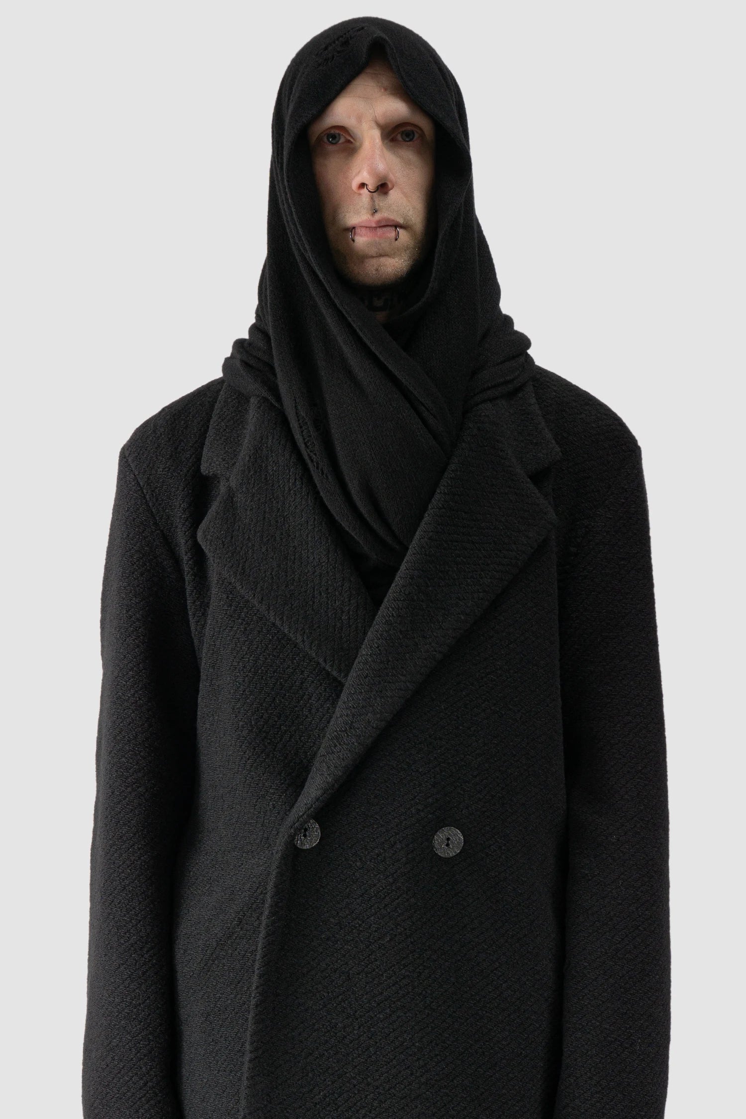 La Haine Inside Us - model hooded view of men’s FW25 Black Oversized Loop Viscose Blend Knit Scarf