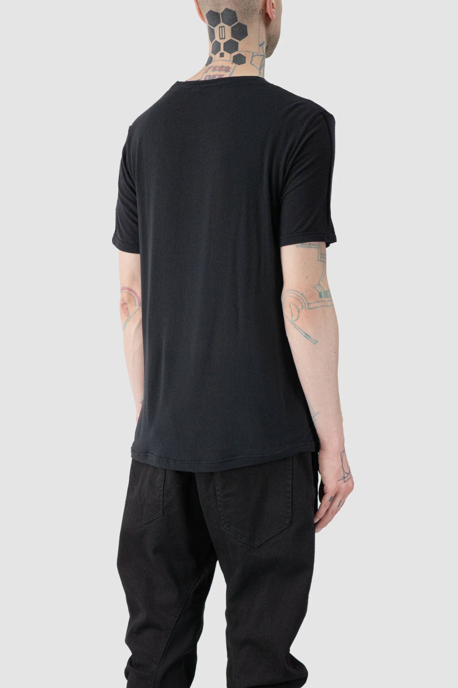 La Haine Inside Us - model back side view of men’s FW25 Black Relaxed Cashmere Blend T-Shirt