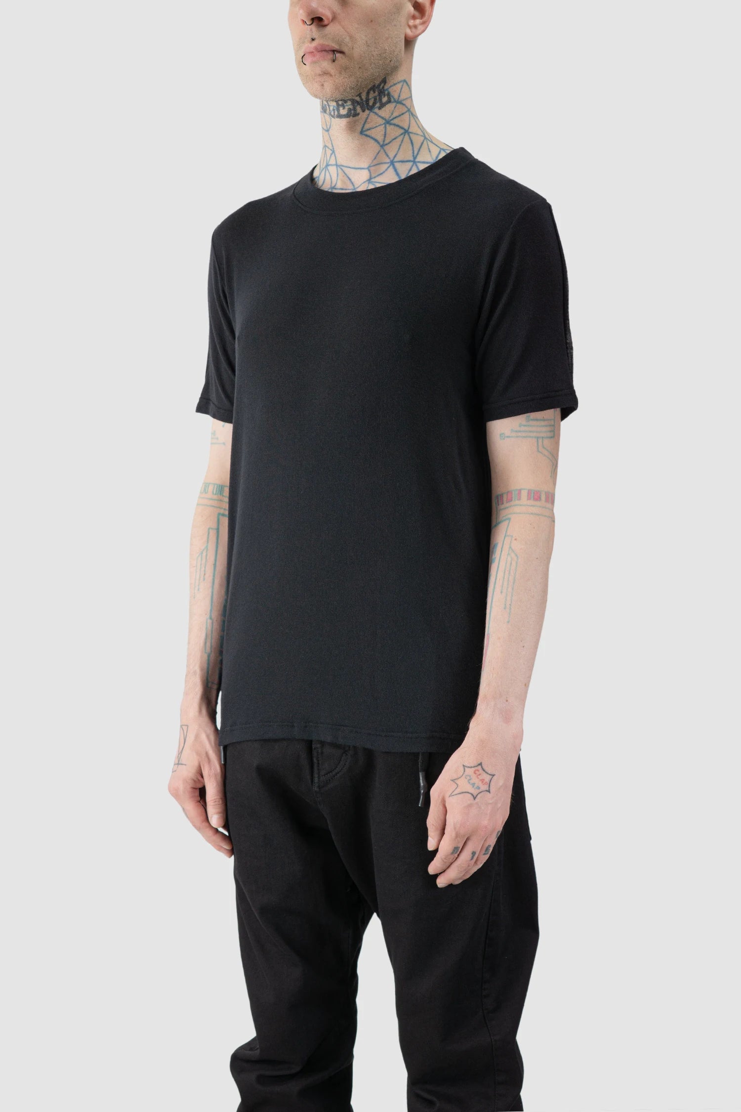 La Haine Inside Us - model front side view of men’s FW25 Black Relaxed Cashmere Blend T-Shirt