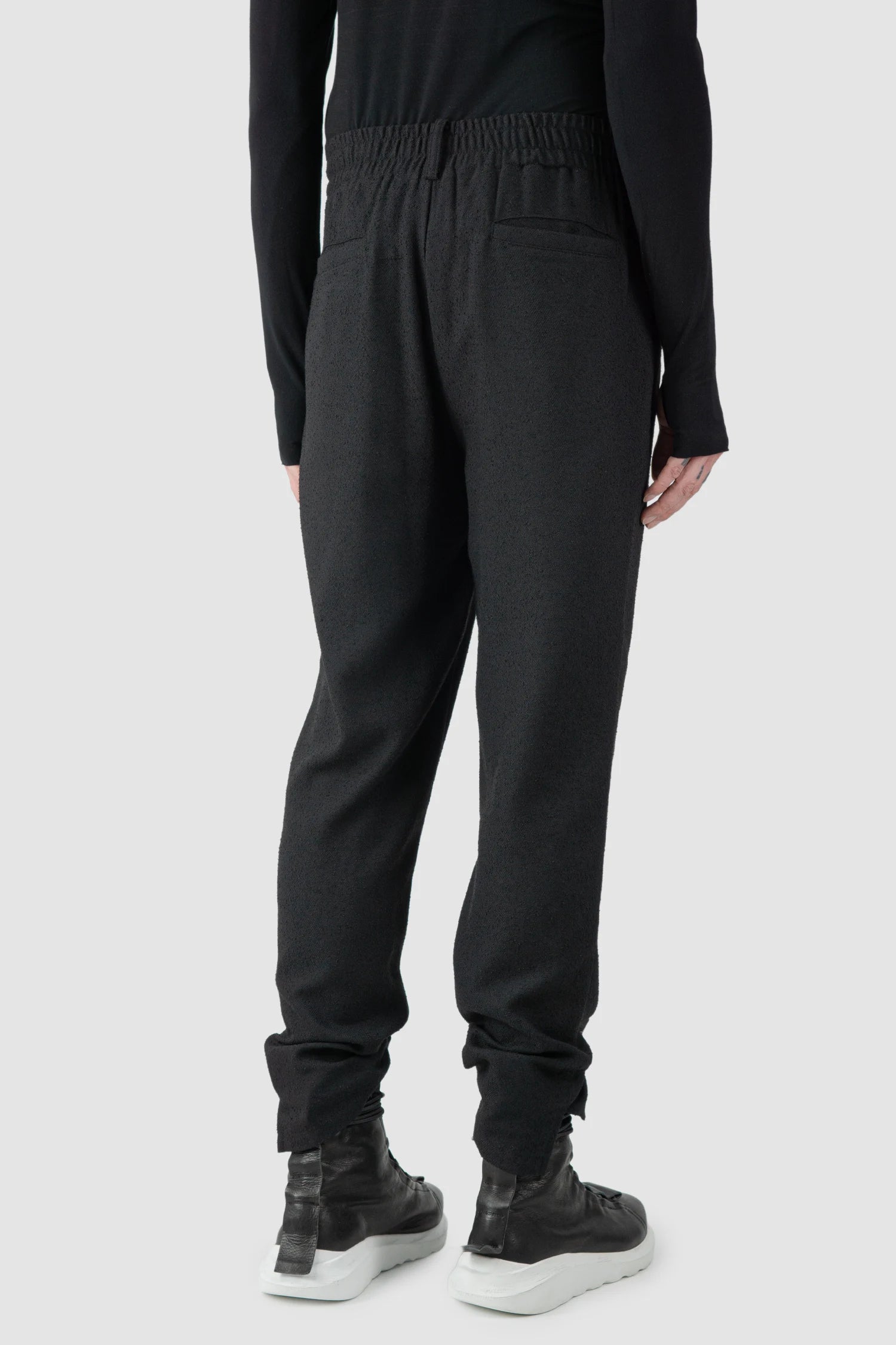 La Haine Inside Us - model back side view of men’s FW25 Black Relaxed Soft Bouclé Trousers