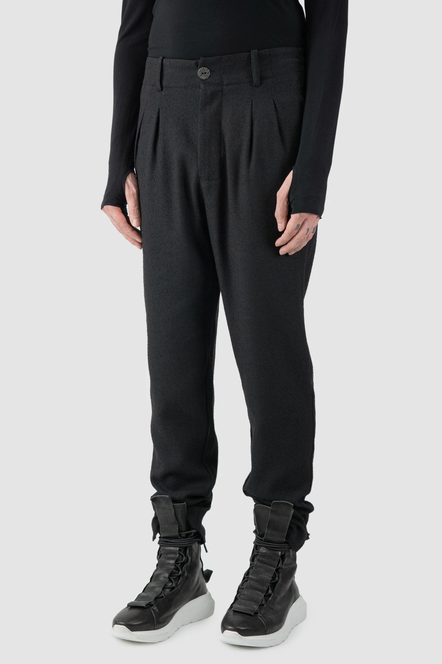 La Haine Inside Us - model side view of men’s FW25 Black Relaxed Soft Bouclé Trousers