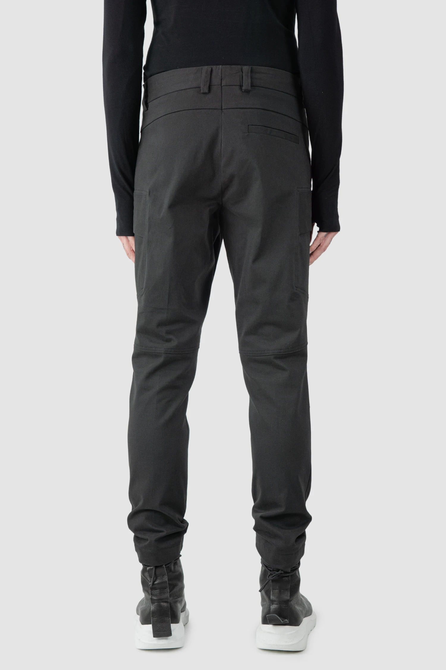 La Haine Inside Us - model back view of men’s FW25 Black Slim Fit Stretch Cotton Cargo Trousers
