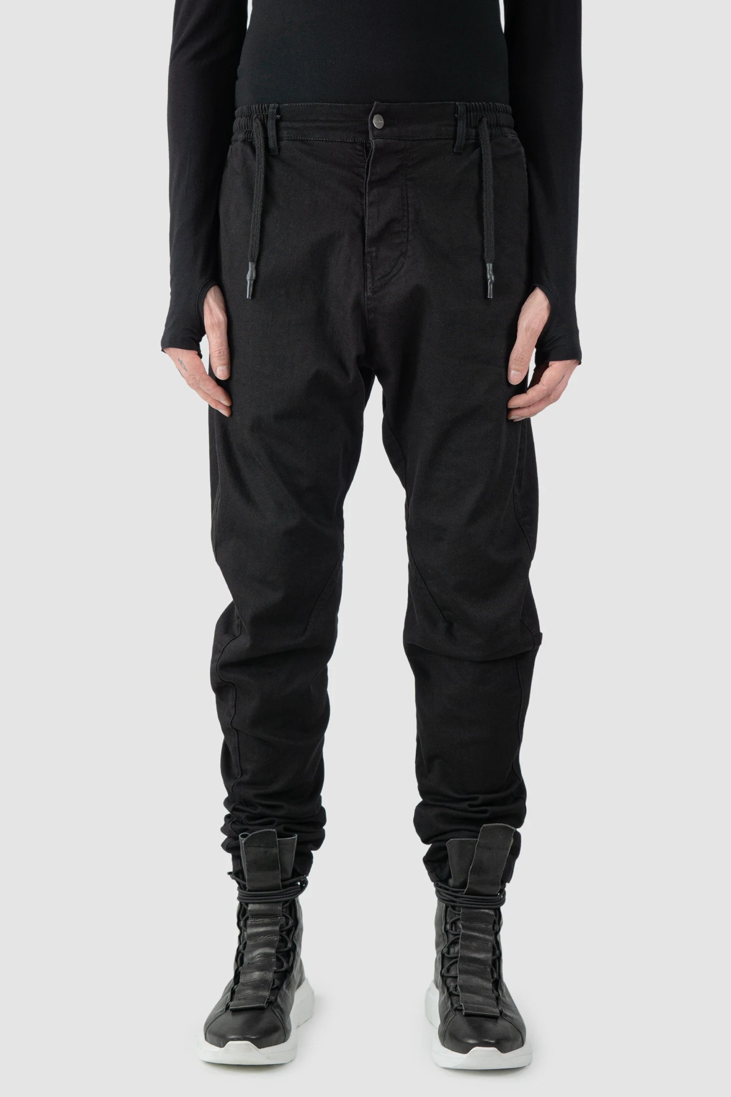 La Haine Inside Us - model front view of men’s FW25 Black Twisted Leg Stretch Denim Jeans