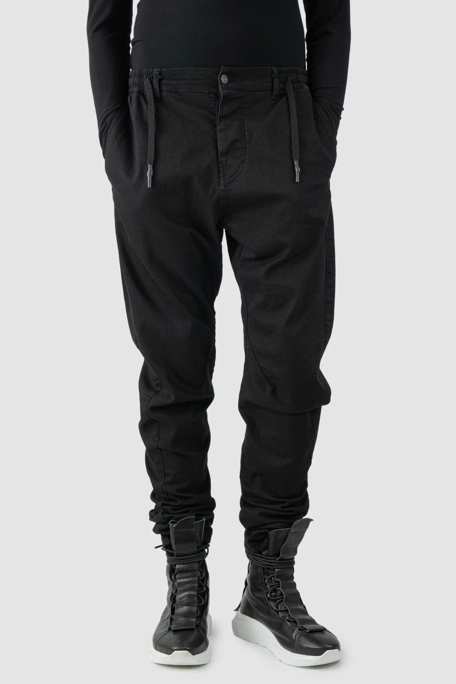 La Haine Inside Us - model front relaxed view of men’s FW25 Black Twisted Leg Stretch Denim Jeans