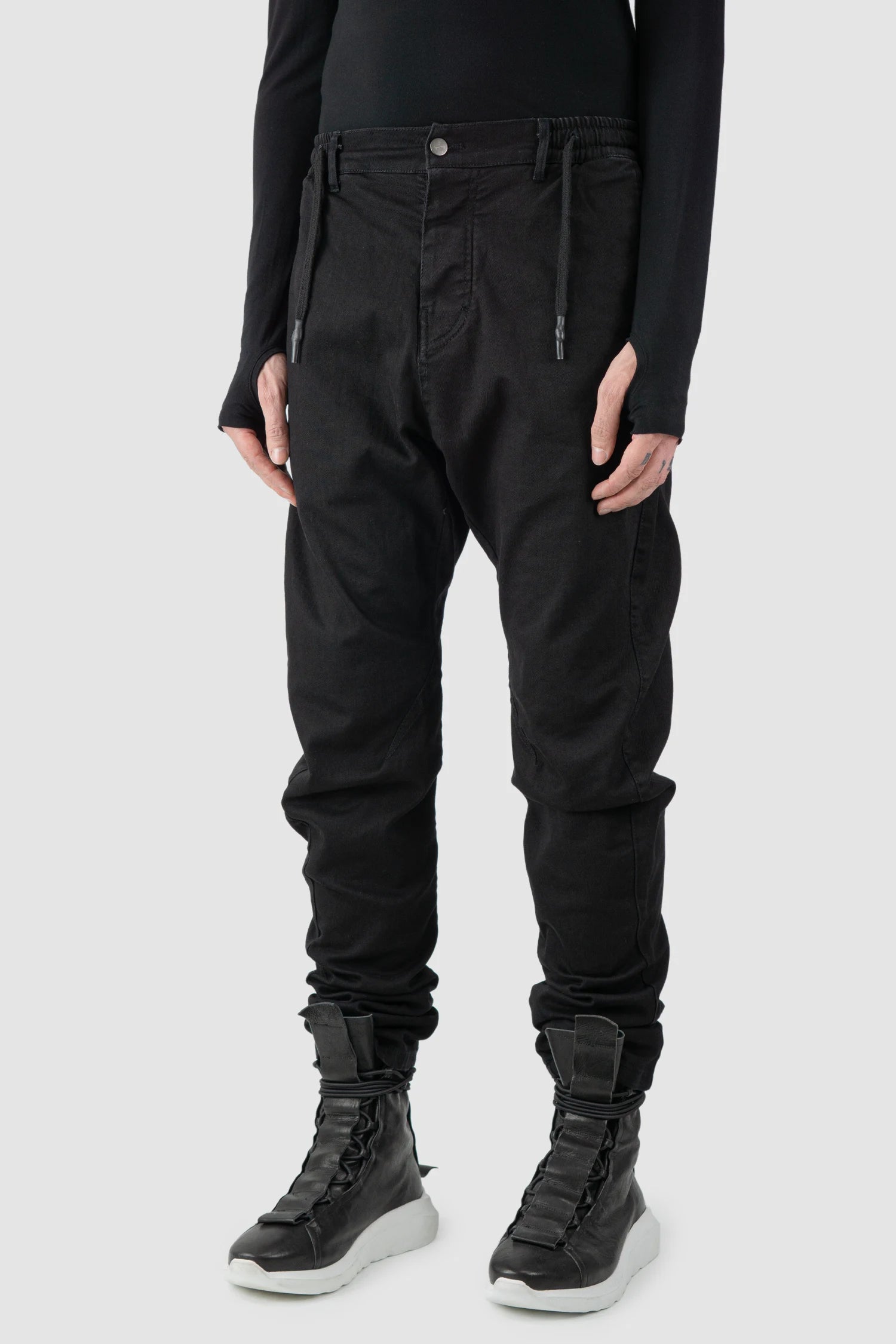 La Haine Inside Us - model front side view of men’s FW25 Black Twisted Leg Stretch Denim Jeans