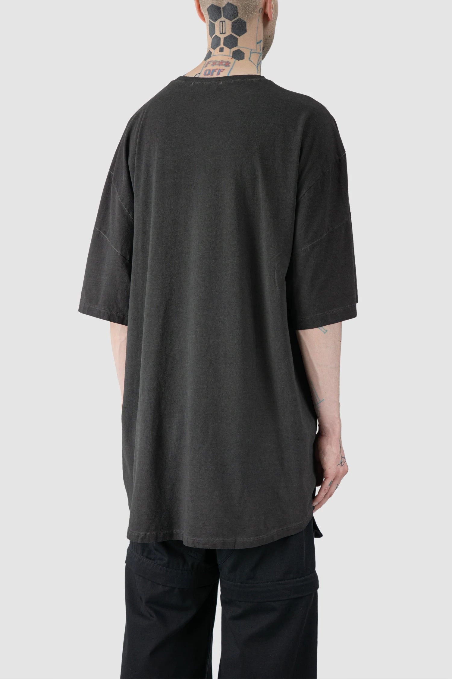 La Haine Inside Us - model back side view of men’s FW25 Grey Oversized Garment Dyed Cotton T-Shirt