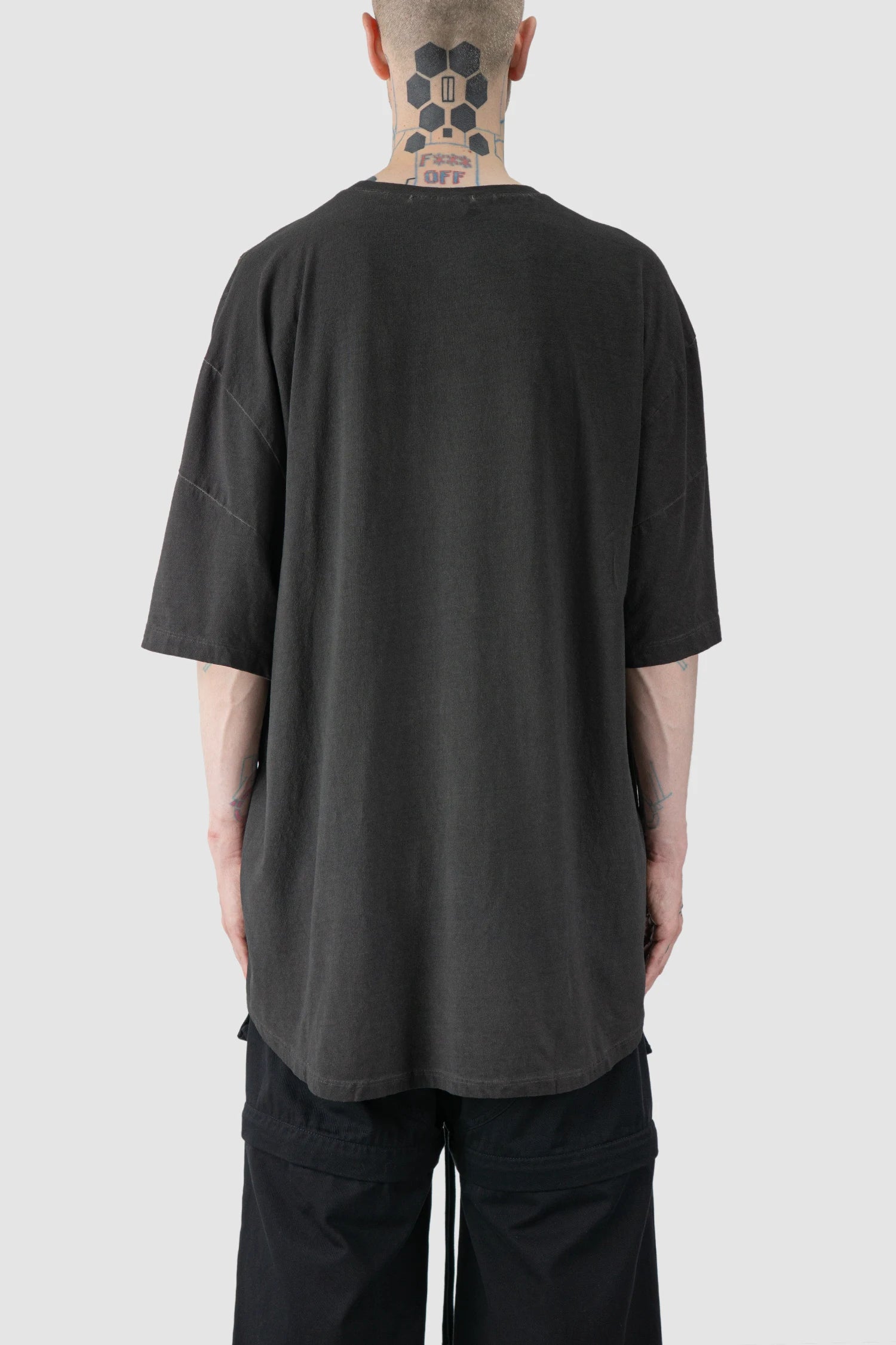 La Haine Inside Us - model back view of men’s FW25 Grey Oversized Garment Dyed Cotton T-Shirt