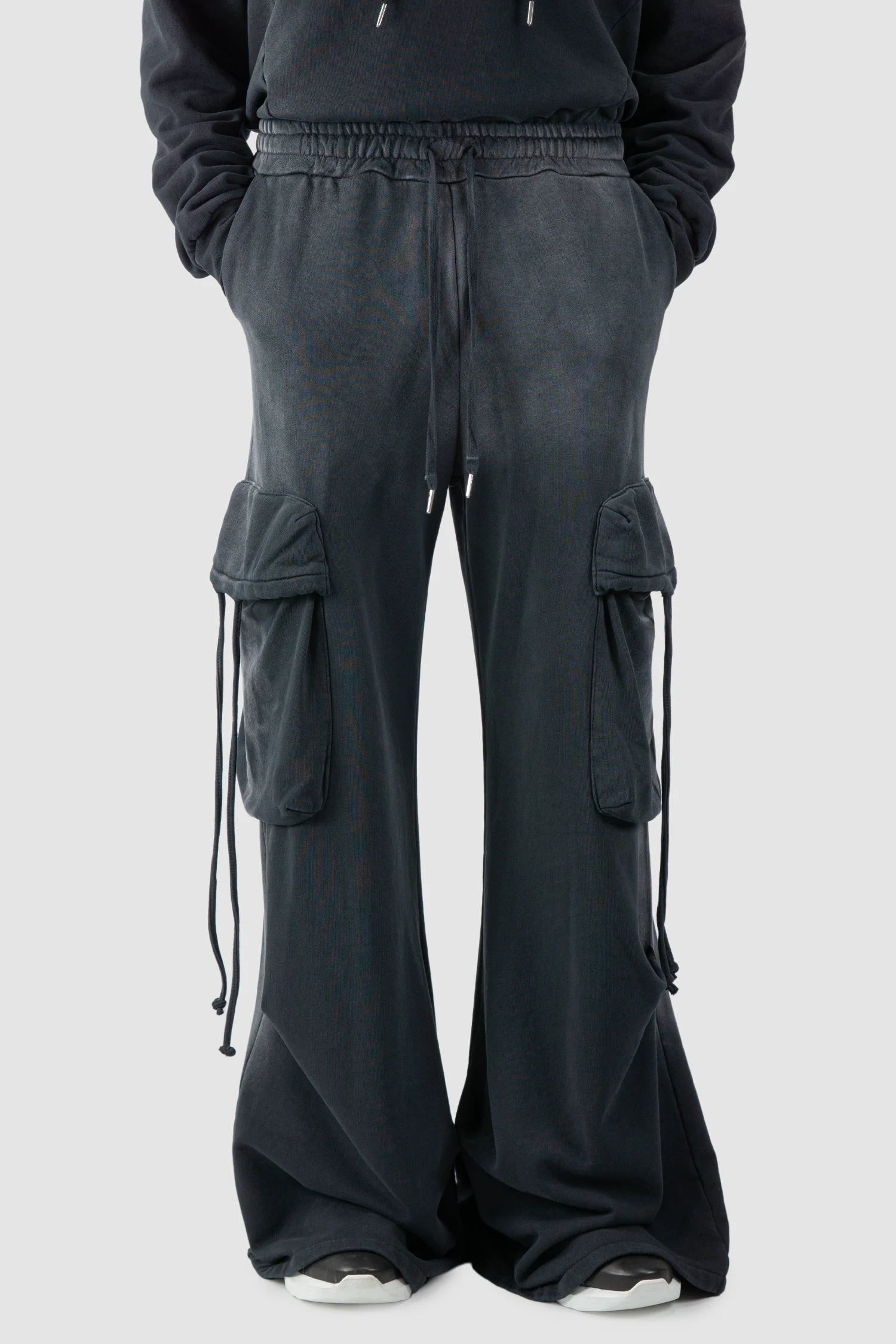 La Haine Inside Us - model front relaxed view of men’s FW25 Grey Sprayed Cotton Wide Leg Cargo Jogger Pants