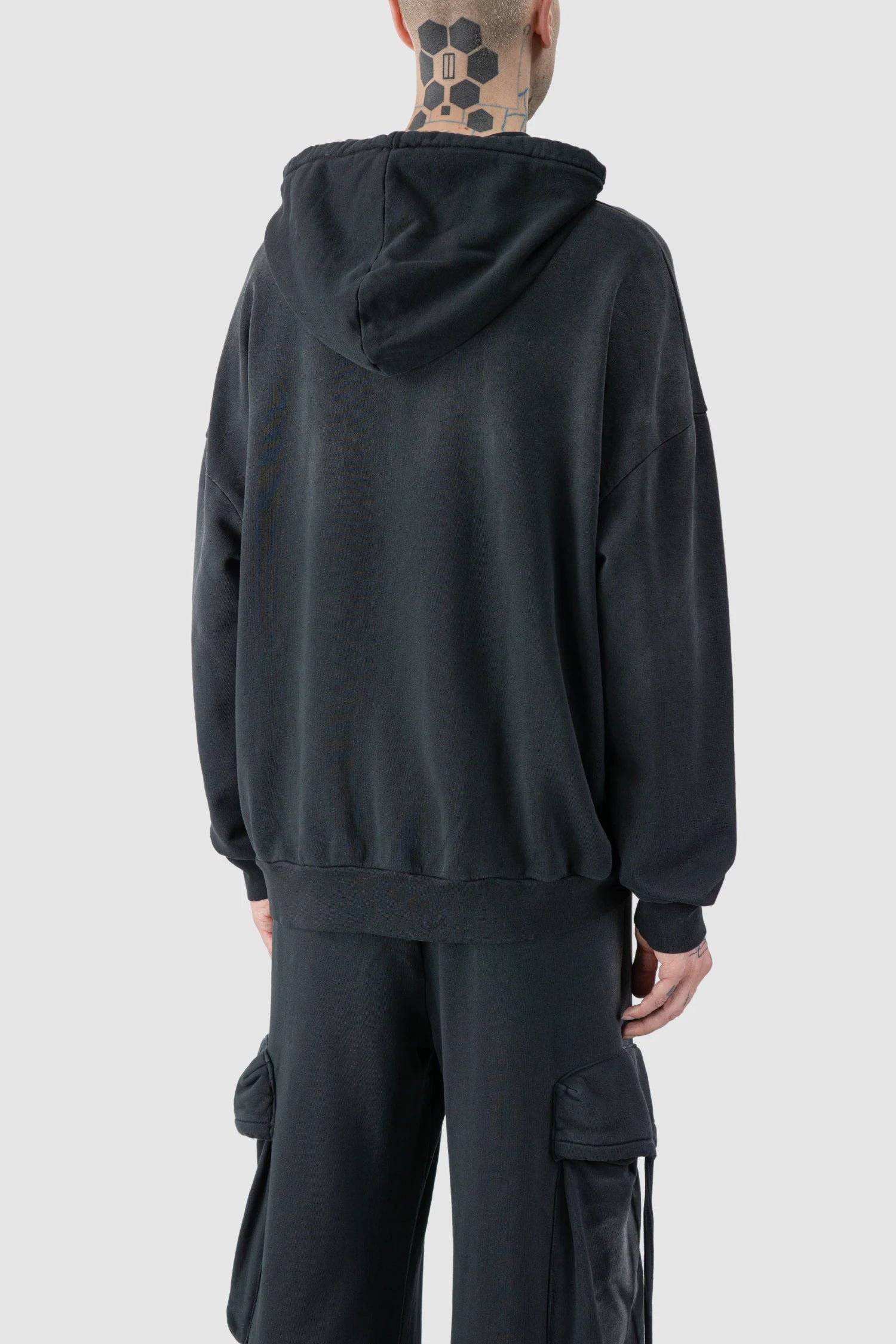 La Haine Inside Us - model back side view of men’s FW25 Grey Sprayed Degrade Cotton Hooded Sweater