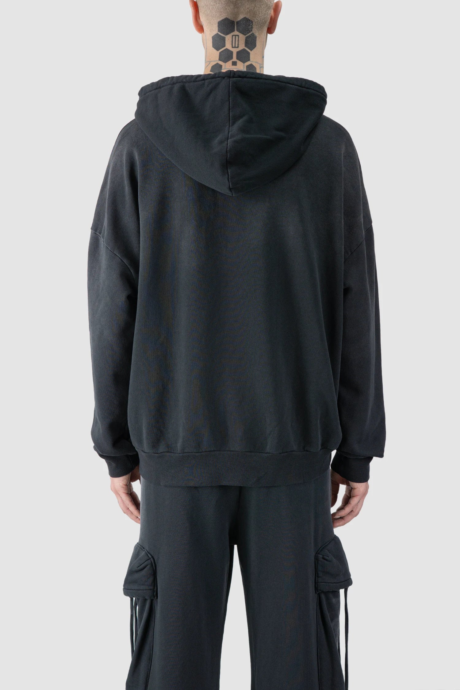 La Haine Inside Us - model back view of men’s FW25 Grey Sprayed Degrade Cotton Hooded Sweater
