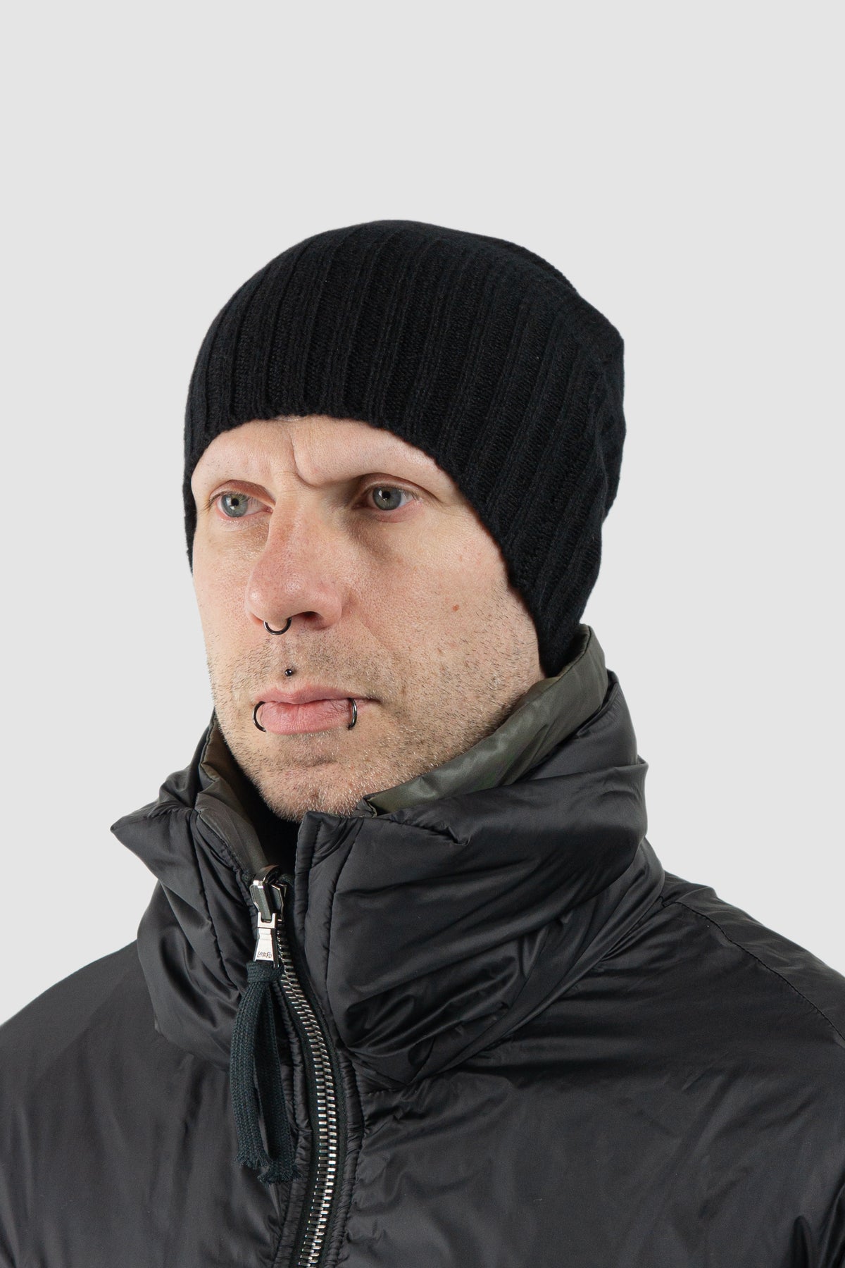 Masnada - Men's Black Cashmere Knit Beanie - model left view Masnada - Men's Black Cashmere Knit Beanie - model left view