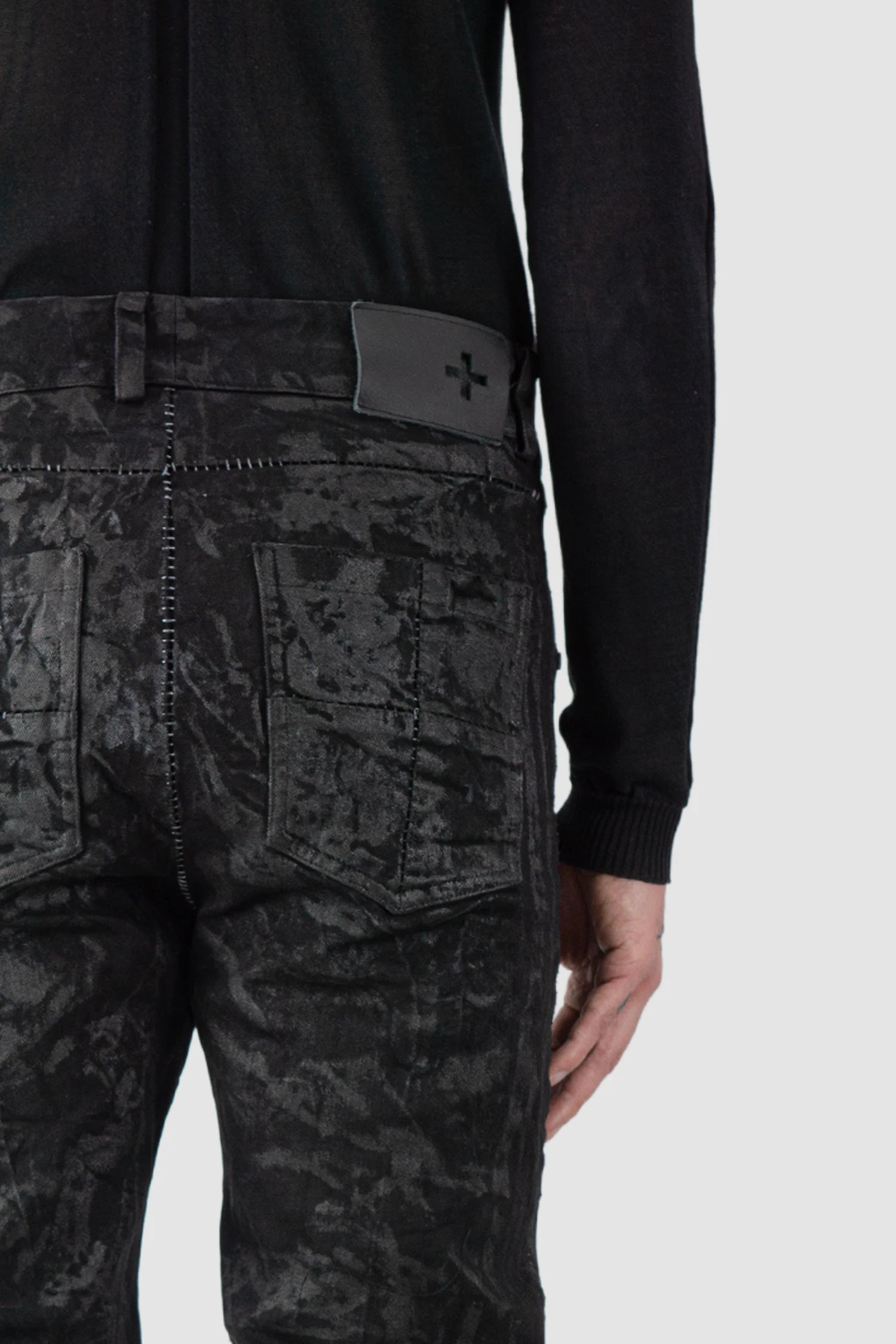MD75 - model back detail view of men’s Black Sandpaper Coated Stacked Denim Jeans