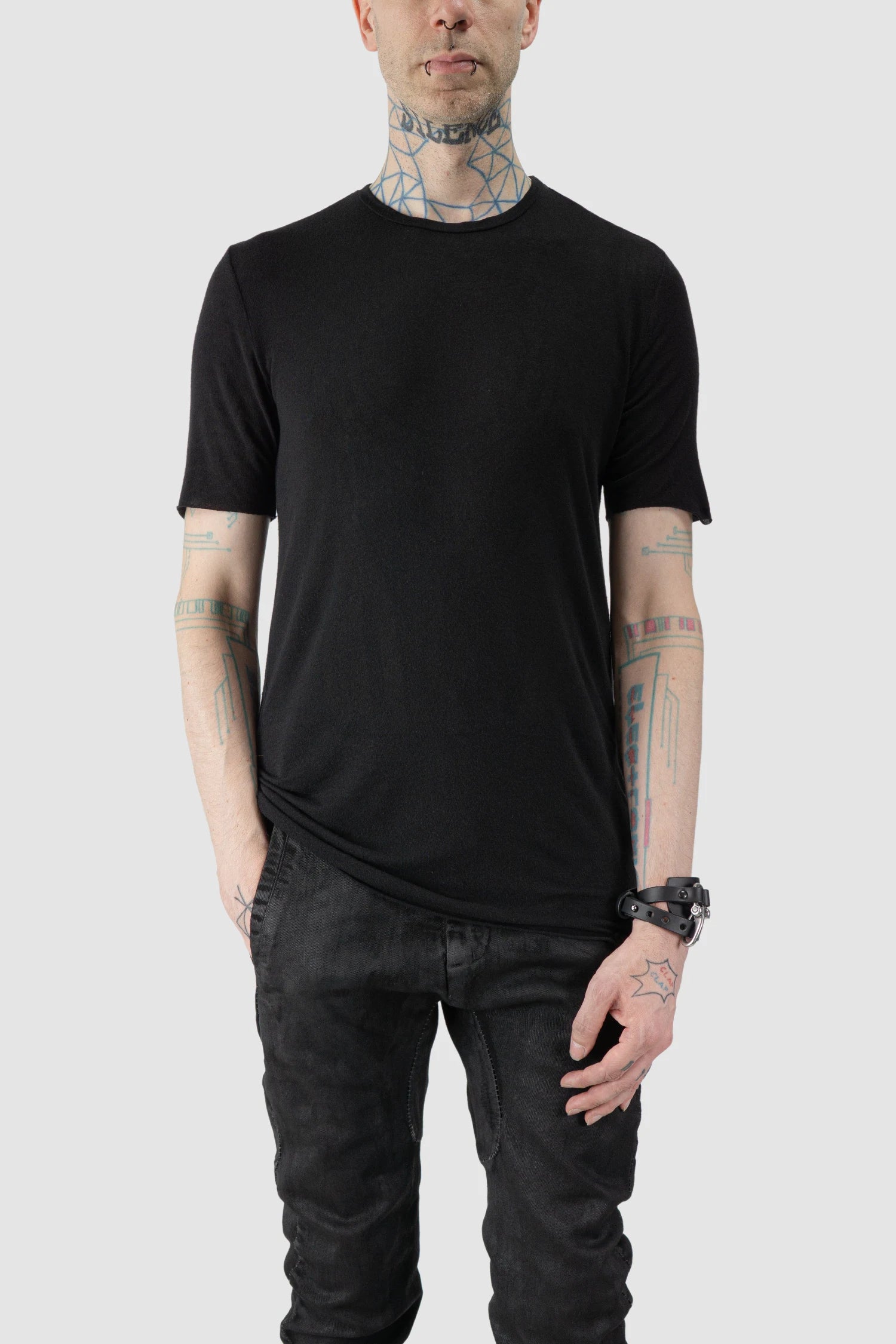 MD75 - model front relaxed view of men’s Black Cashmere Blend Short Sleeve T-Shirt