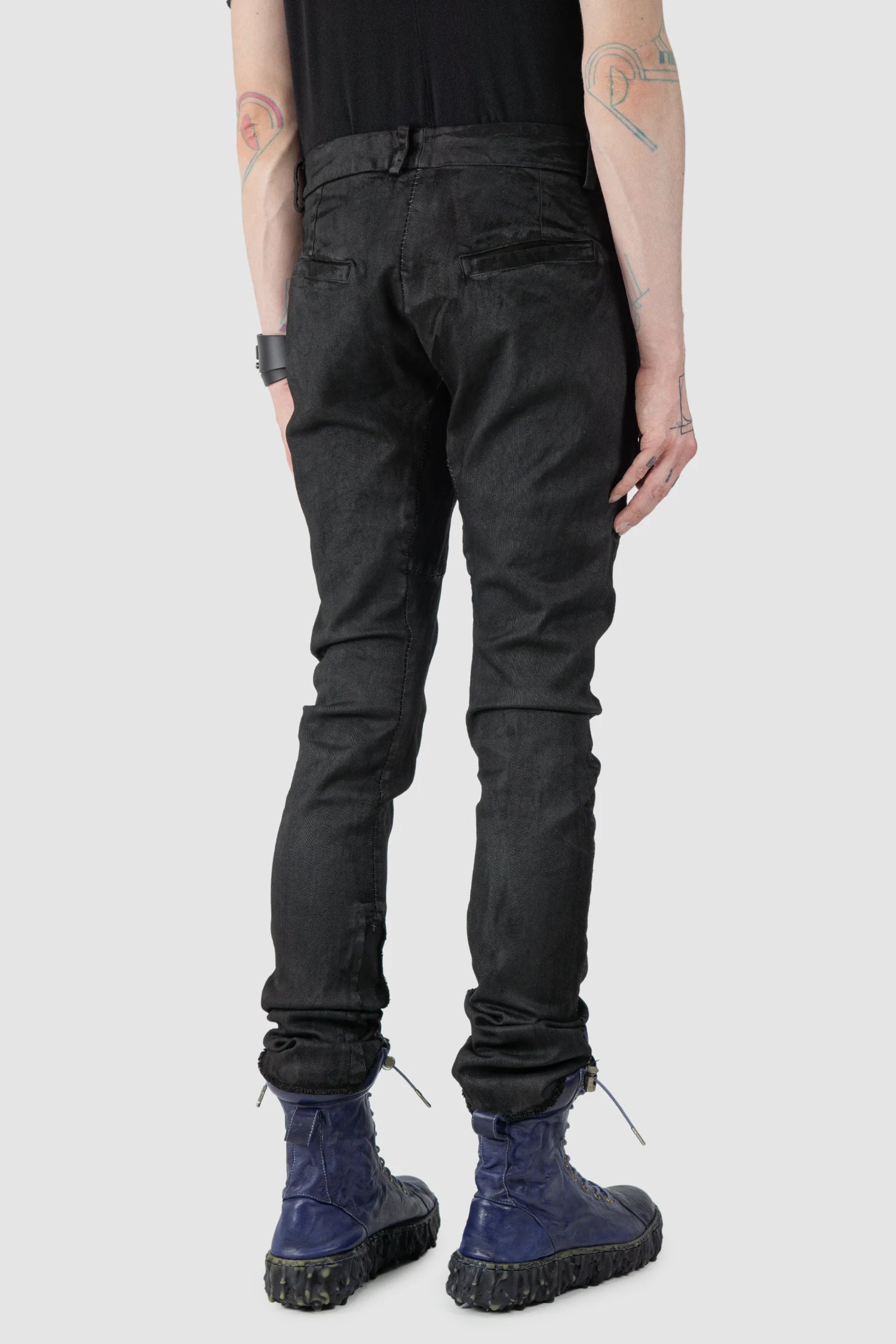 MD75 - model back side view of men’s Black Irregular Heavy Waxed Denim Jeans