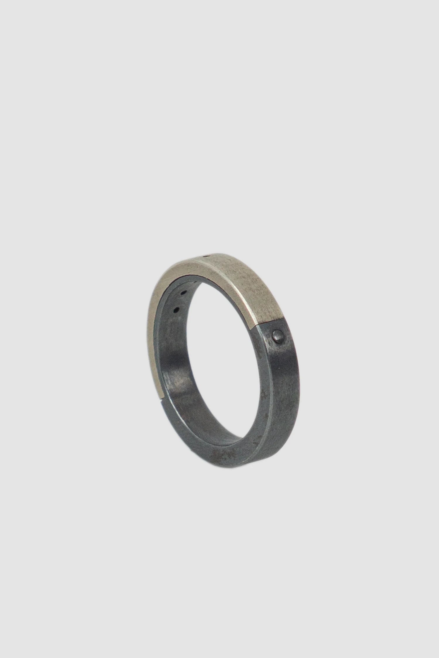 Parts of Four – Black Silver Dirty Sterling 4 Hole Sistema Ring 4 mm - standing back left view Parts of Four – Black Silver Dirty Sterling 4 Hole Sistema Ring 4 mm - standing back left view
