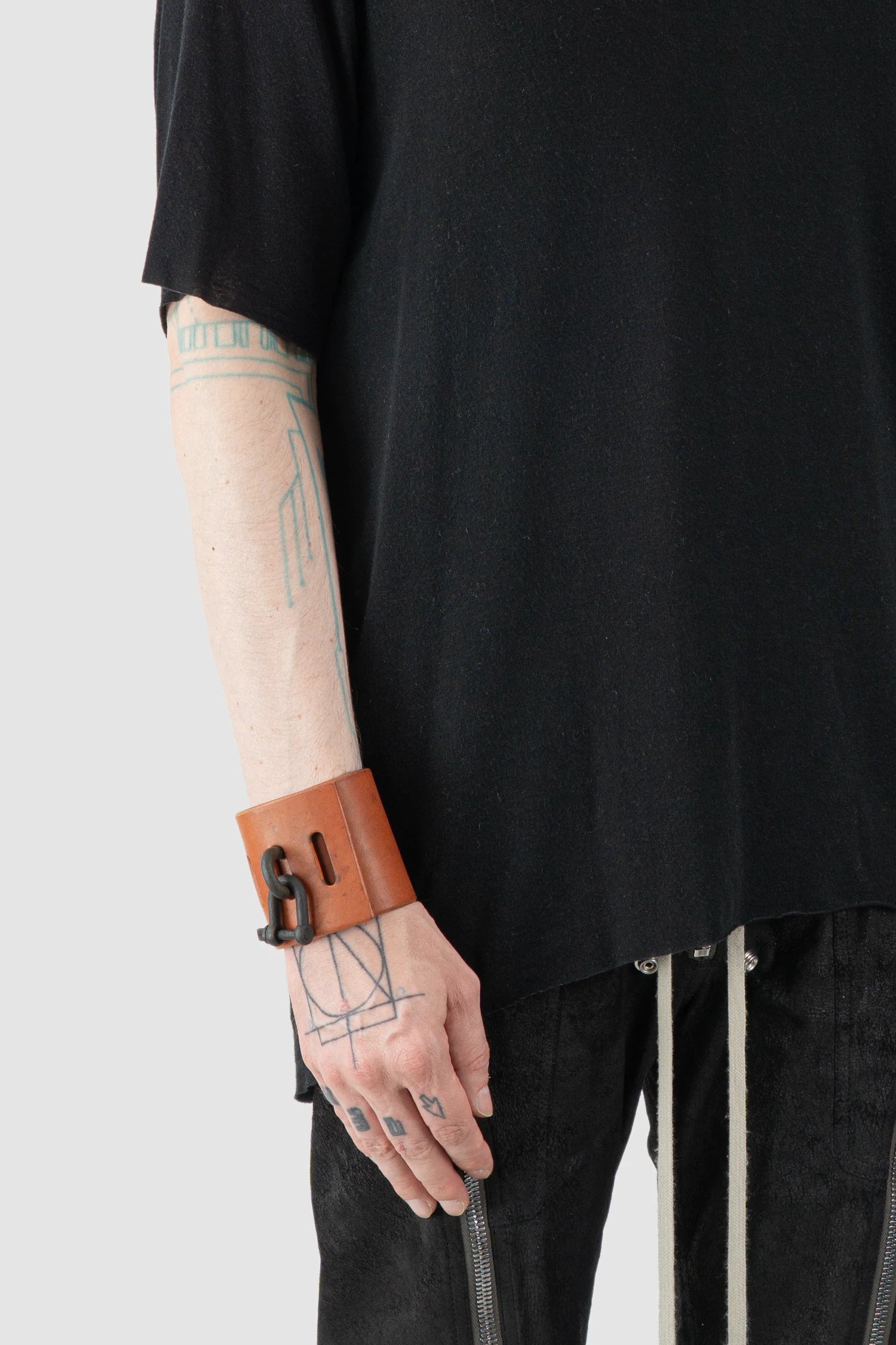 Parts of Four - Orange Leather Black Bronze Restraint Charm Bracelet 70 mm - Model fit view - MONO-KROM Gallery Parts of Four - Orange Leather Black Bronze Restraint Charm Bracelet 70 mm - Model fit view - MONO-KROM Gallery