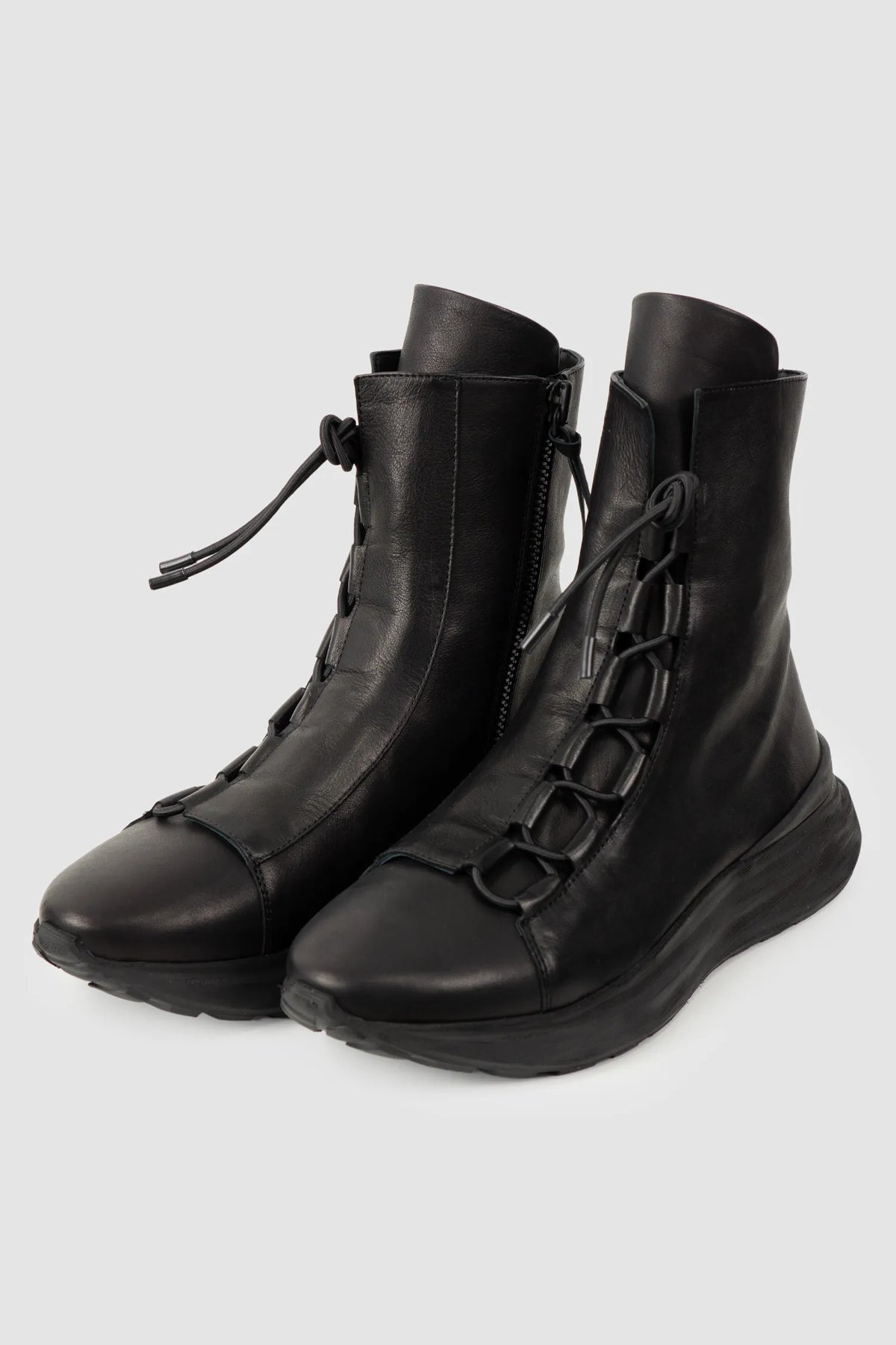 Puro Secret - Black Offset Leather High-Top Sneakers - Pair front left view - MONO-KROM | Gallery Puro Secret - Black Offset Leather High-Top Sneakers - Pair front left view - MONO-KROM | Gallery