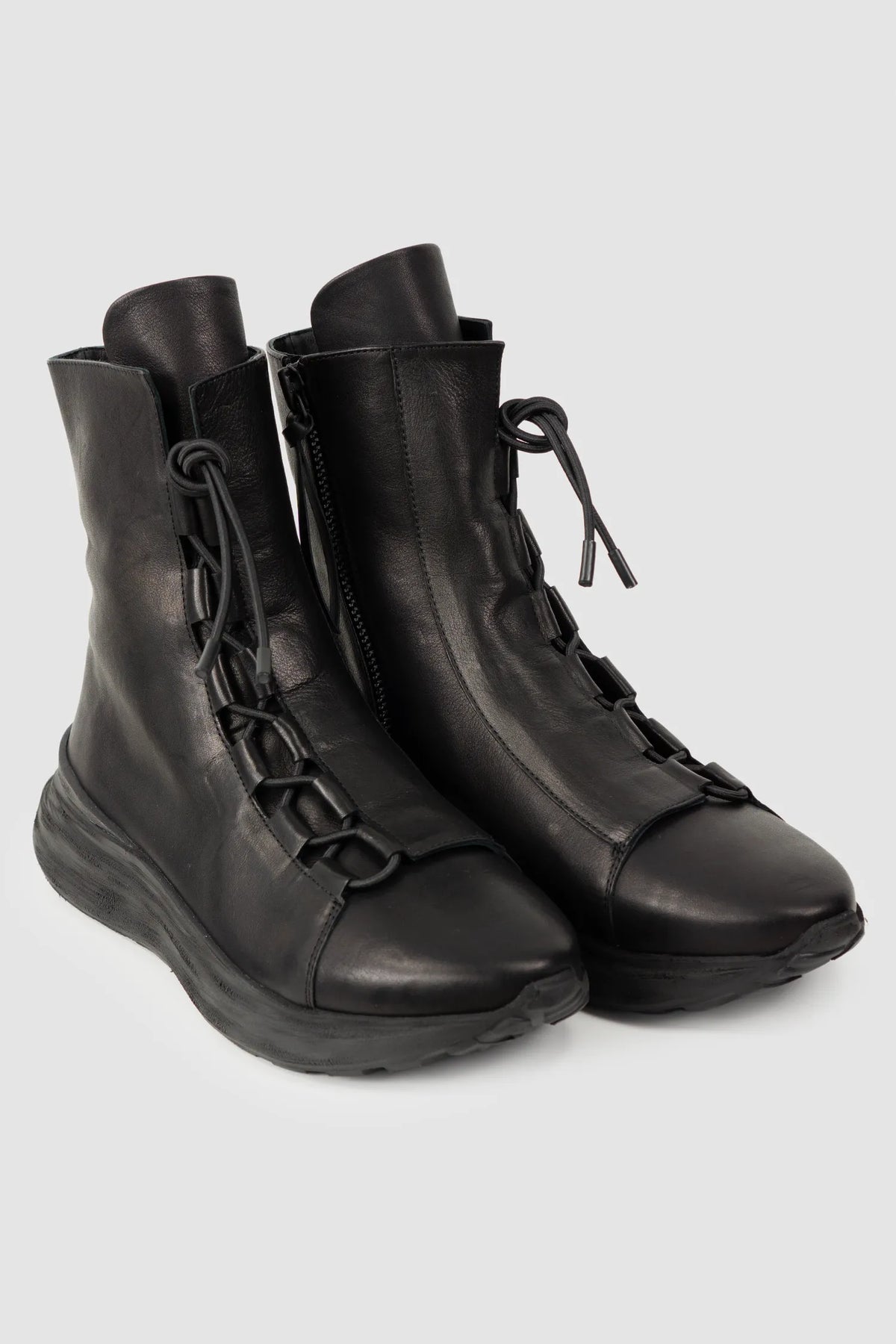 Puro Secret - Black Offset Leather High-Top Sneakers - Pair front right view - MONO-KROM | Gallery Puro Secret - Black Offset Leather High-Top Sneakers - Pair front right view - MONO-KROM | Gallery
