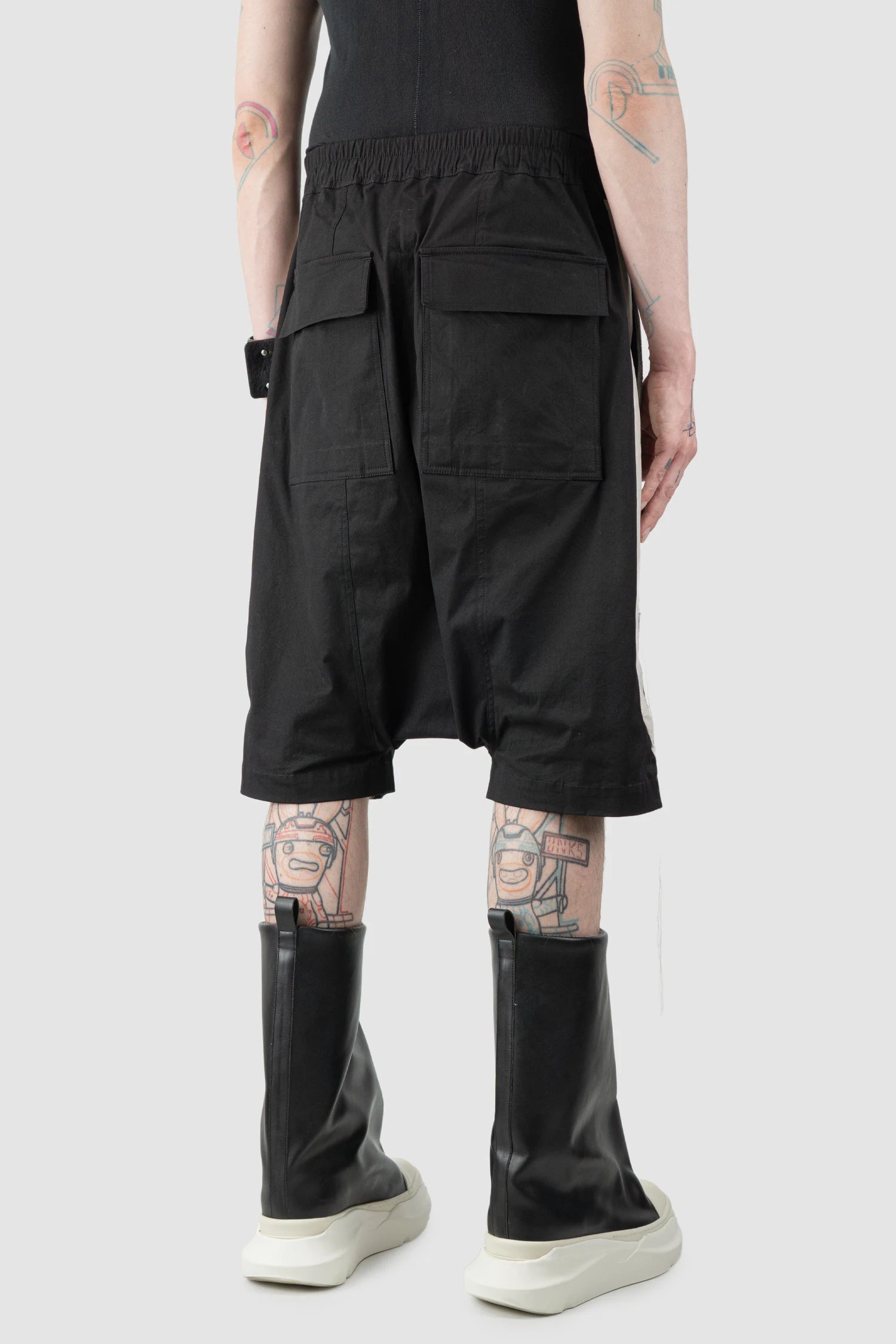 Rick Owens - Black & Pearl Patch Cotton Pod Shorts SS19 "Babel" - model back side view Rick Owens - Black & Pearl Patch Cotton Pod Shorts SS19 "Babel" - model back side view