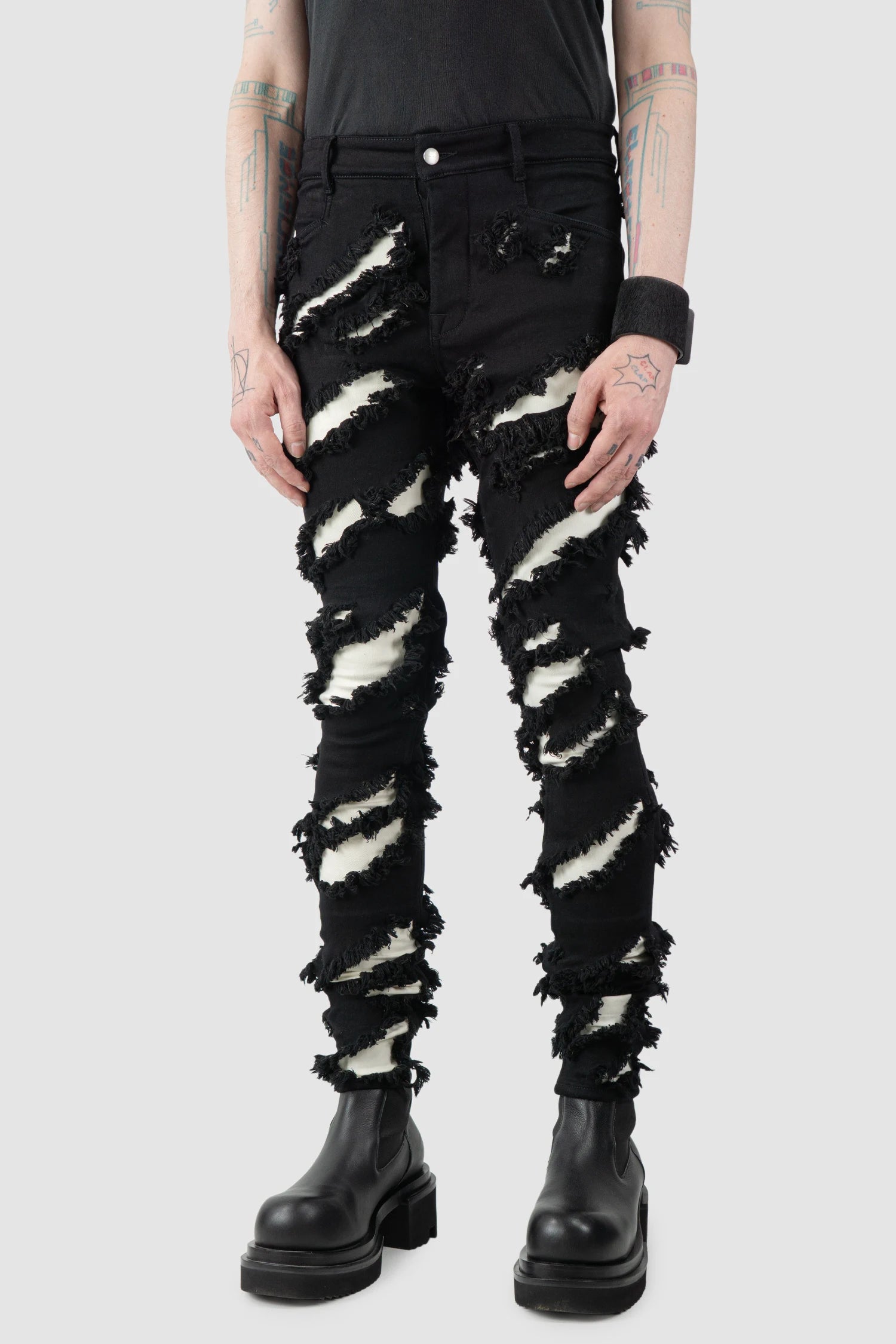 Rick Owens - Black & White Slash Tyrone Jeans FW21 "Gethsemane" - model front side view Rick Owens - Black & White Slash Tyrone Jeans FW21 "Gethsemane" - model front side view