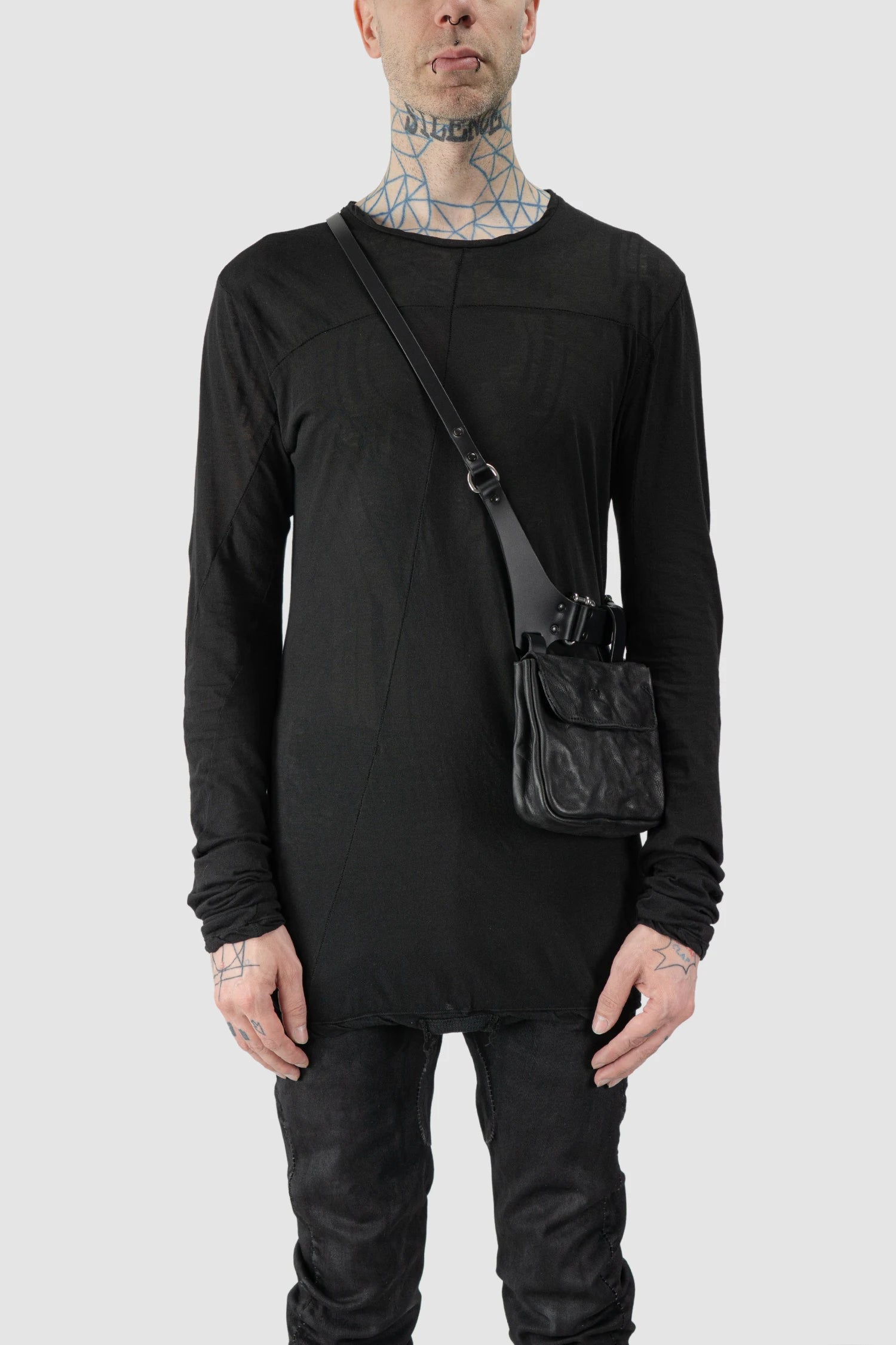 TEO NG - MOO - model front view of men’s Black Leather Crossbody Double Pouch Bag