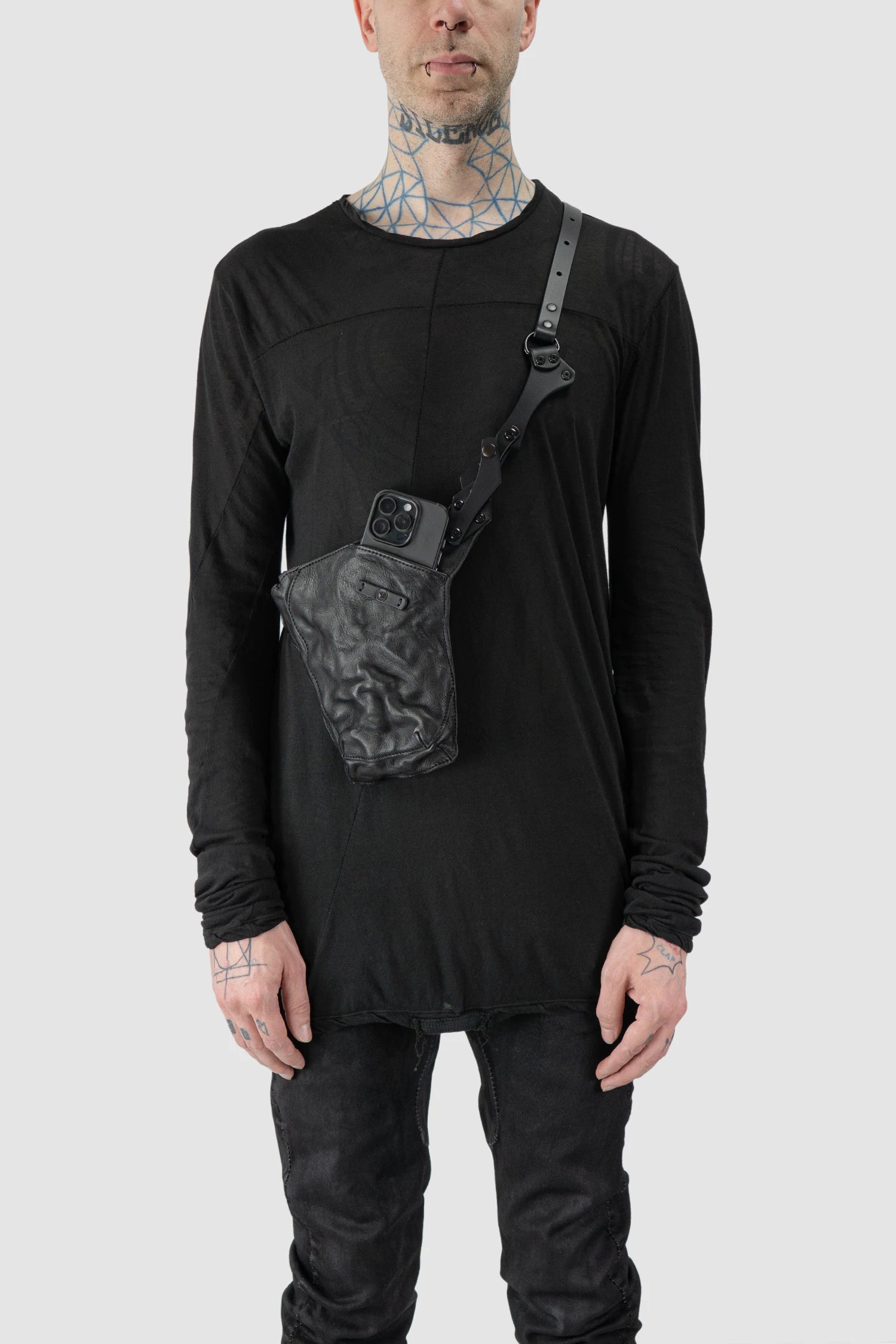 TEO NG - ESYE - model front pocket detail of men’s Black Leather Crossbody Pouch with Zipper