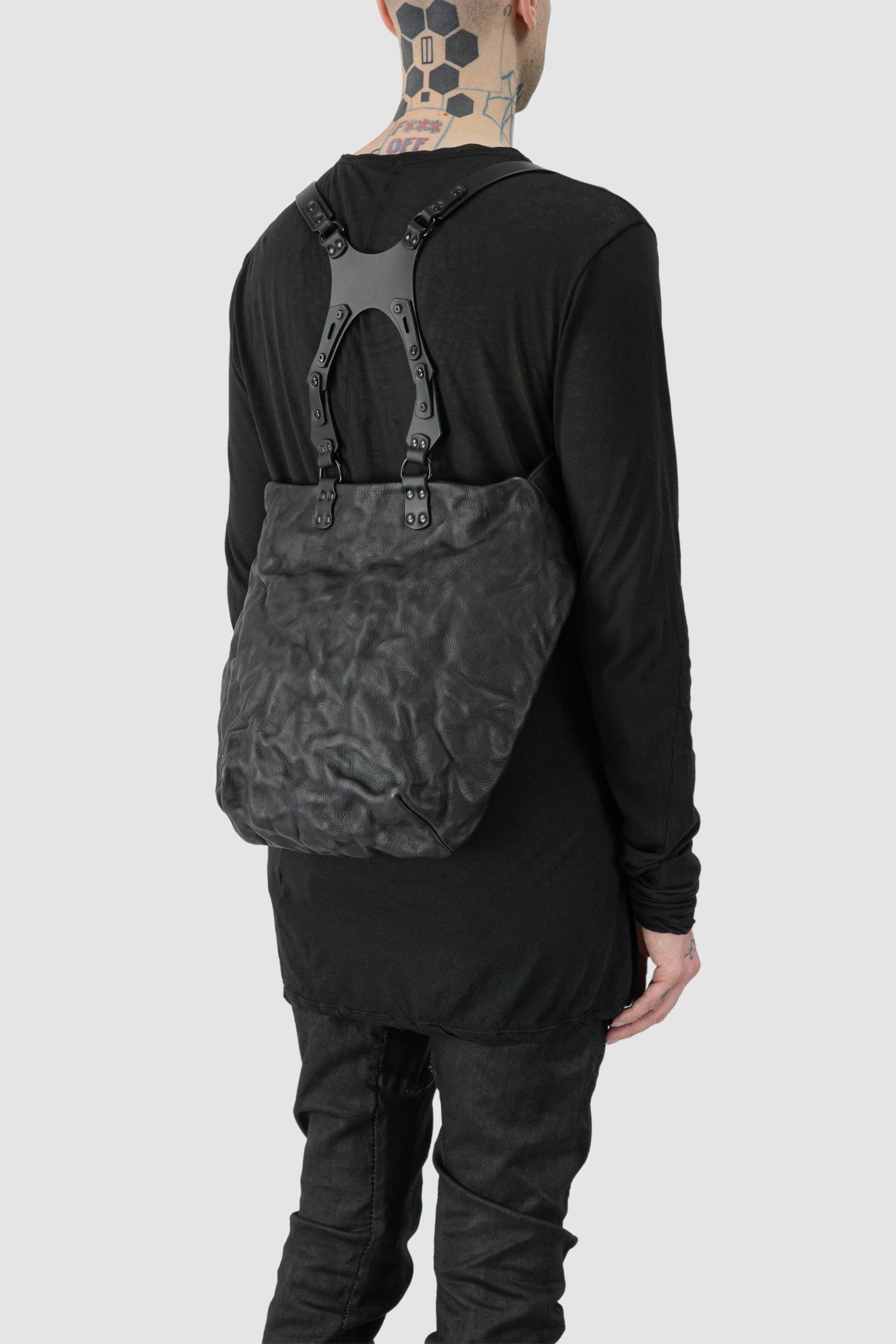 TEO NG - UKA - model back side right view of men’s Black Leather Harness Backpack with Dual Zipper Pockets