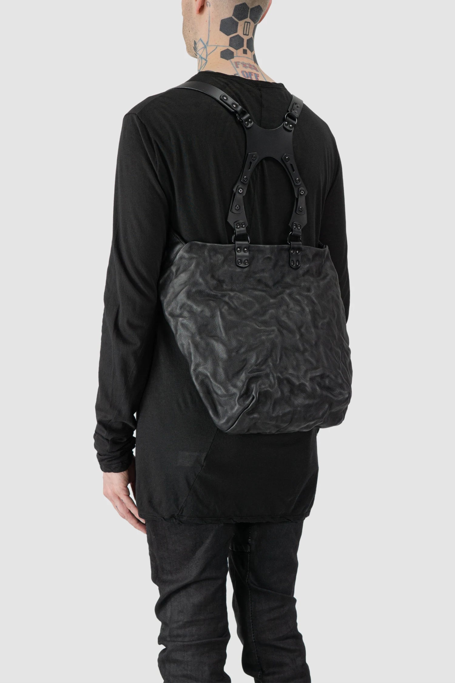 TEO NG - UKA - model back side view of men’s Black Leather Harness Backpack with Dual Zipper Pockets