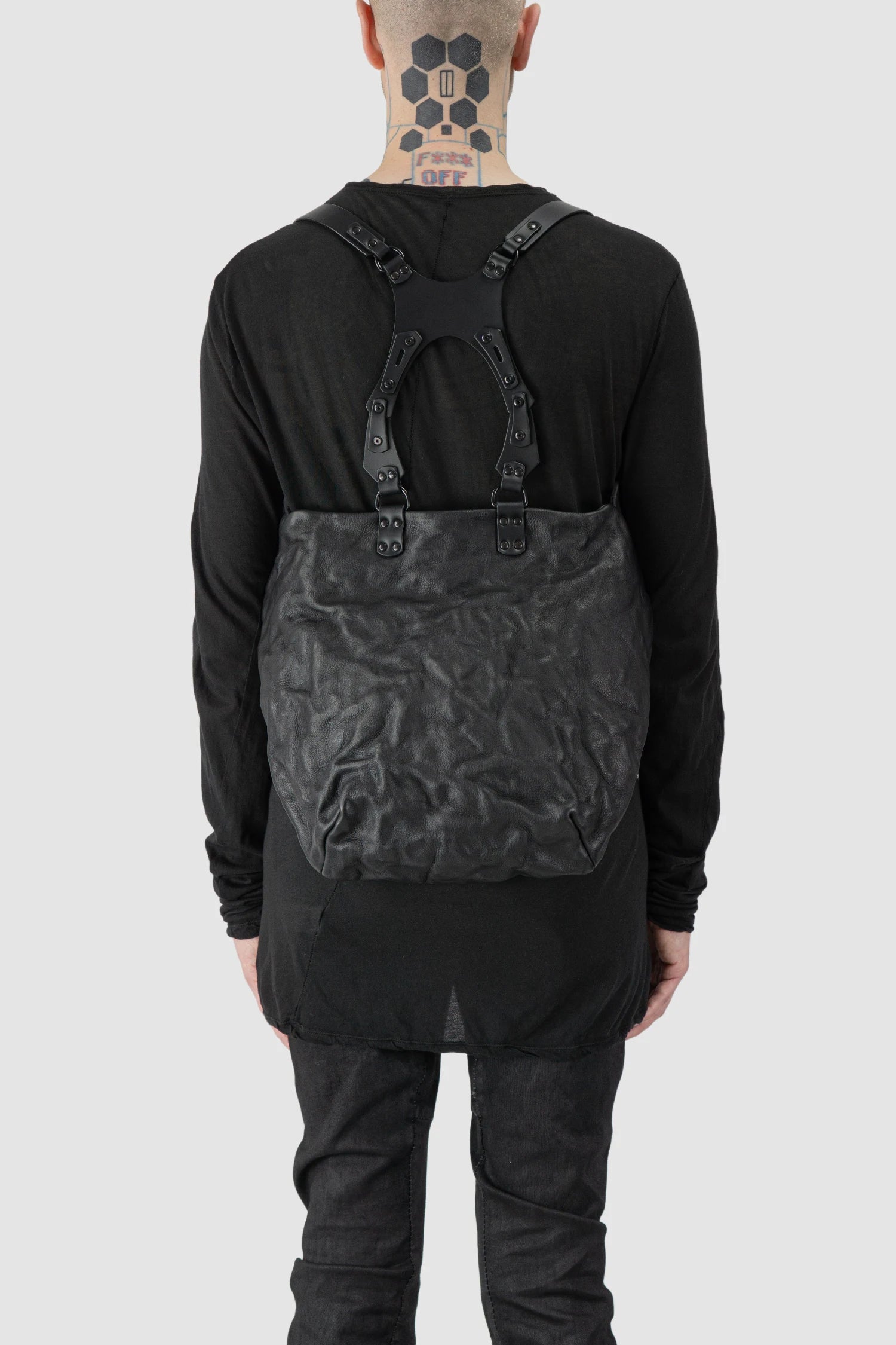 TEO NG - UKA - model back view of men’s Black Leather Harness Backpack with Dual Zipper Pockets