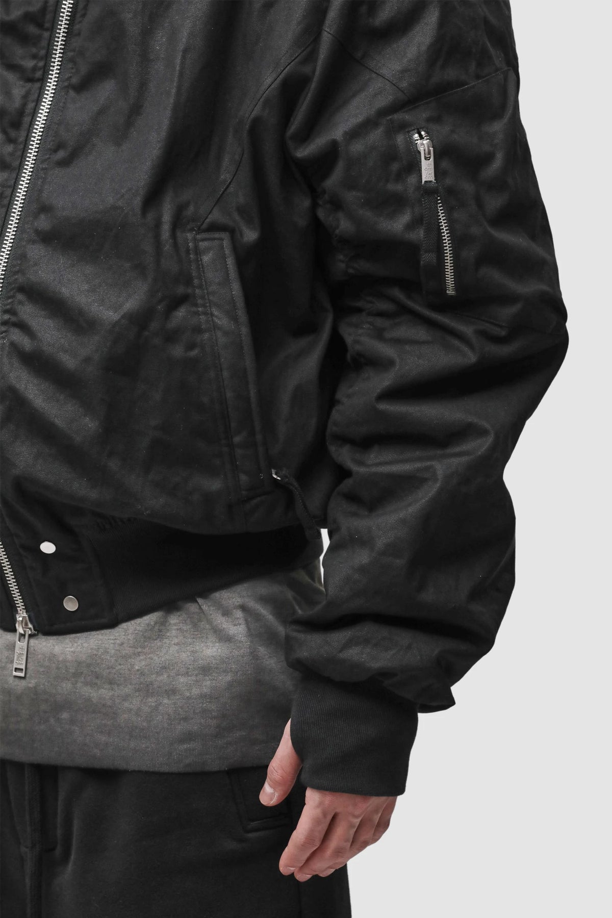 Thom Krom - Men’s Black Hooded Cotton Bomber Jacket M-J-89 arm detail view Thom Krom - Men’s Black Hooded Cotton Bomber Jacket M-J-89 arm detail view