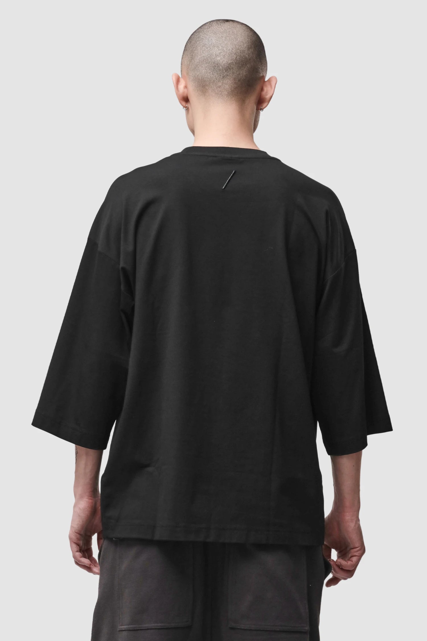 Thom Krom - Men’s Black Oversized Cotton Modal T-Shirt M-TS-1005 model back view Thom Krom - Men’s Black Oversized Cotton Modal T-Shirt M-TS-1005 model back view