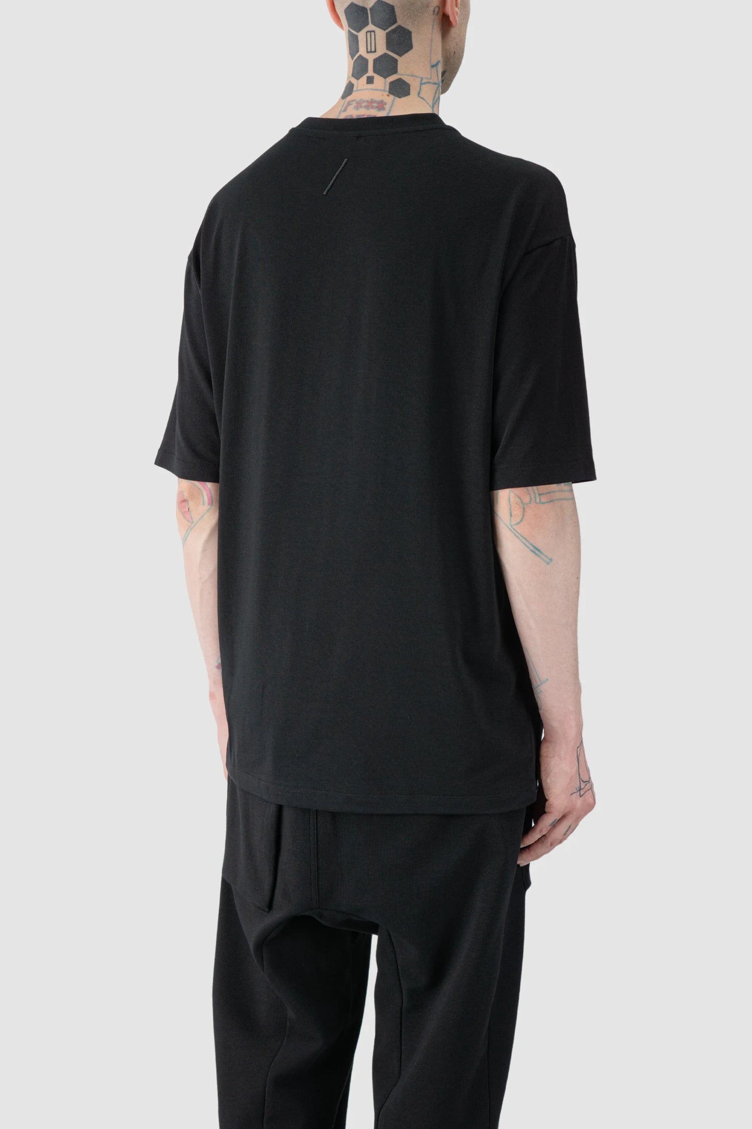 Thom Krom - model back side view of Black Oversized Raglan Sleeve Modal Jersey T-Shirt