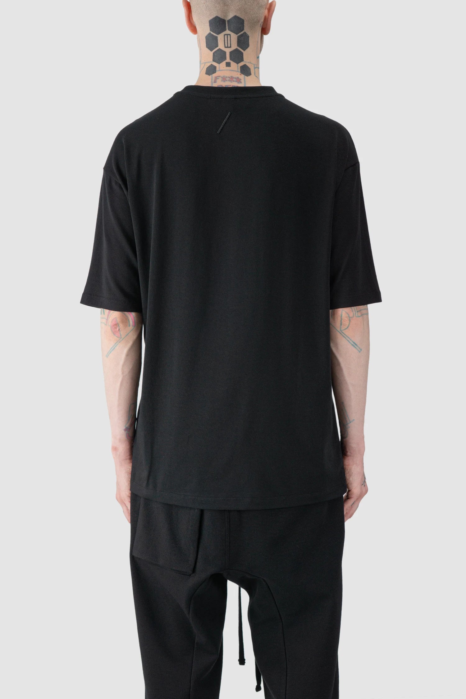 Thom Krom - model back view of Black Oversized Raglan Sleeve Modal Jersey T-Shirt