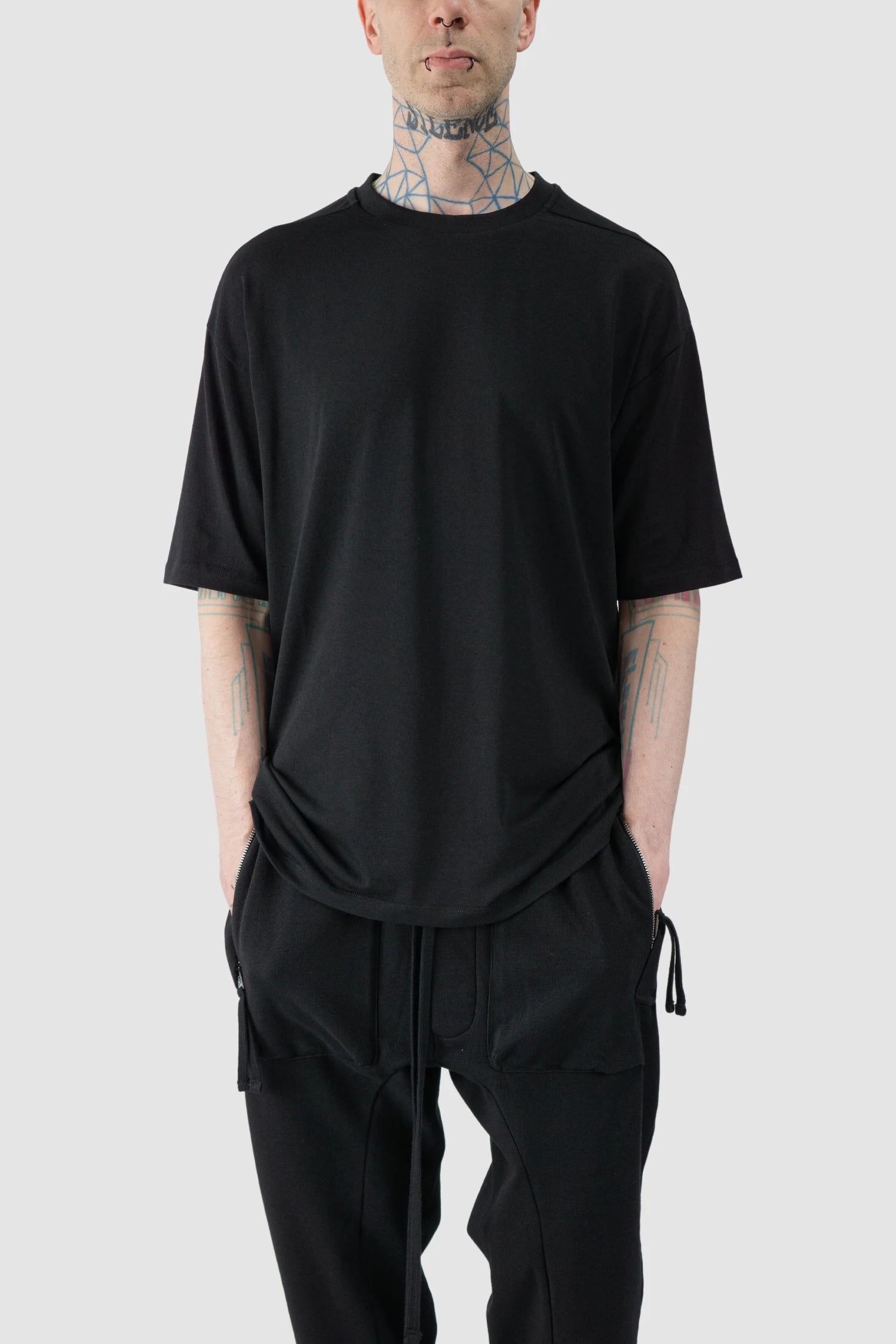 Thom Krom - model front relaxed view of Black Oversized Raglan Sleeve Modal Jersey T-Shirt