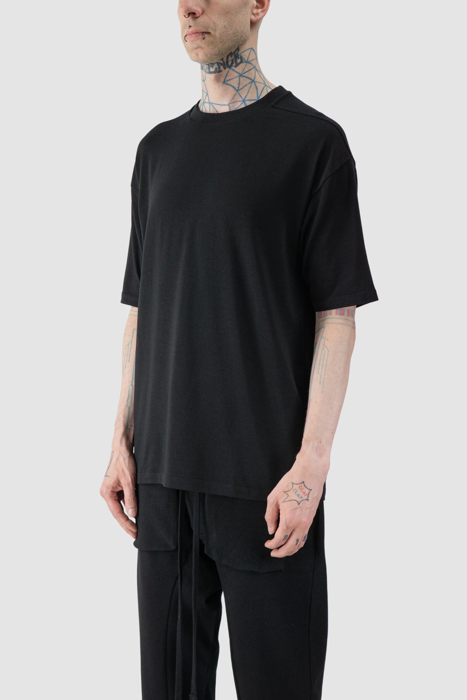 Thom Krom - model front side of Black Oversized Raglan Sleeve Modal Jersey T-Shirt