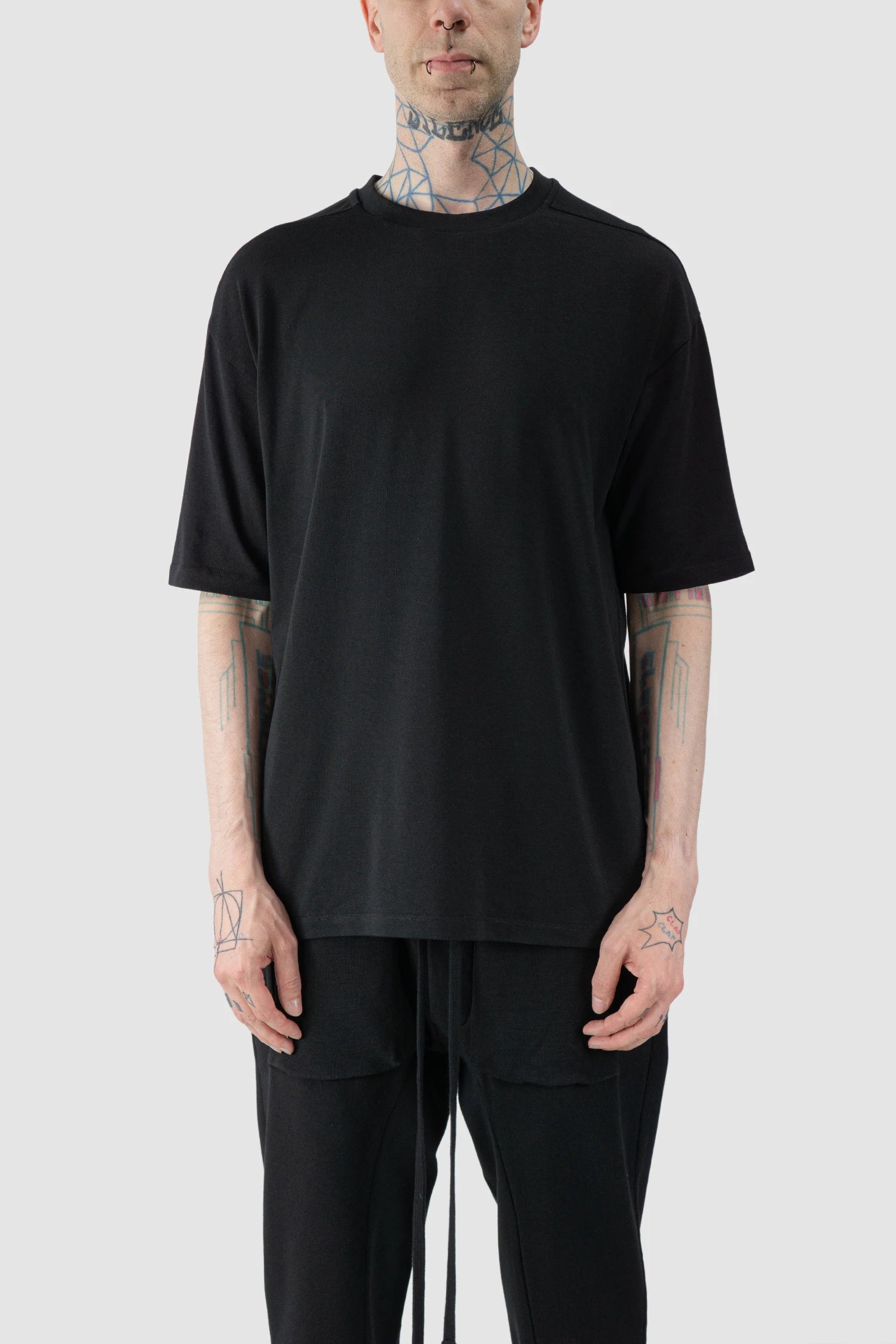 Thom Krom - model front view of Black Oversized Raglan Sleeve Modal Jersey T-Shirt