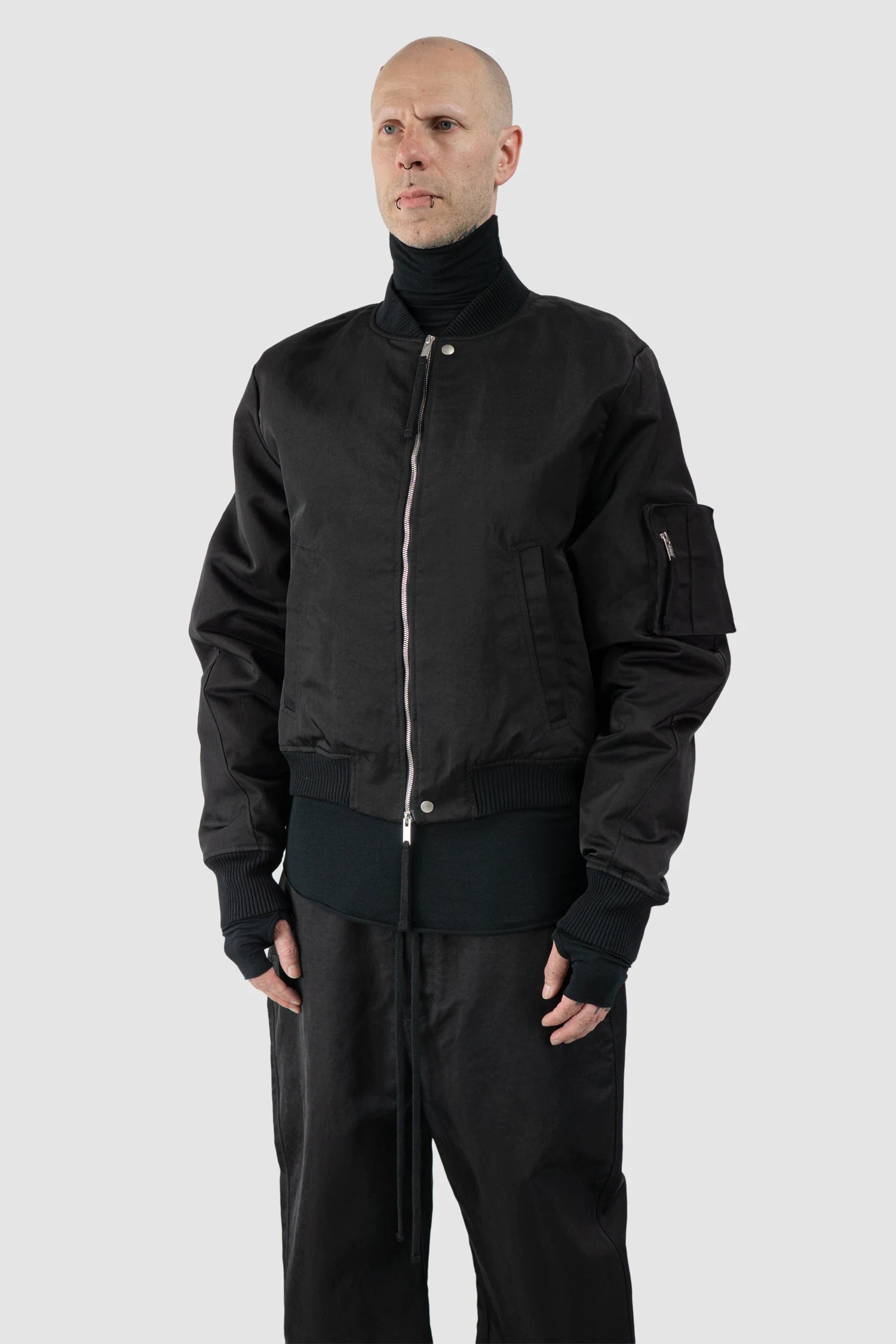 Thom Krom – Men's Black Recycled Tech Bomber Jacket - model side view - MONO-KROM | Gallery Thom Krom – Men's Black Recycled Tech Bomber Jacket - model side view - MONO-KROM | Gallery