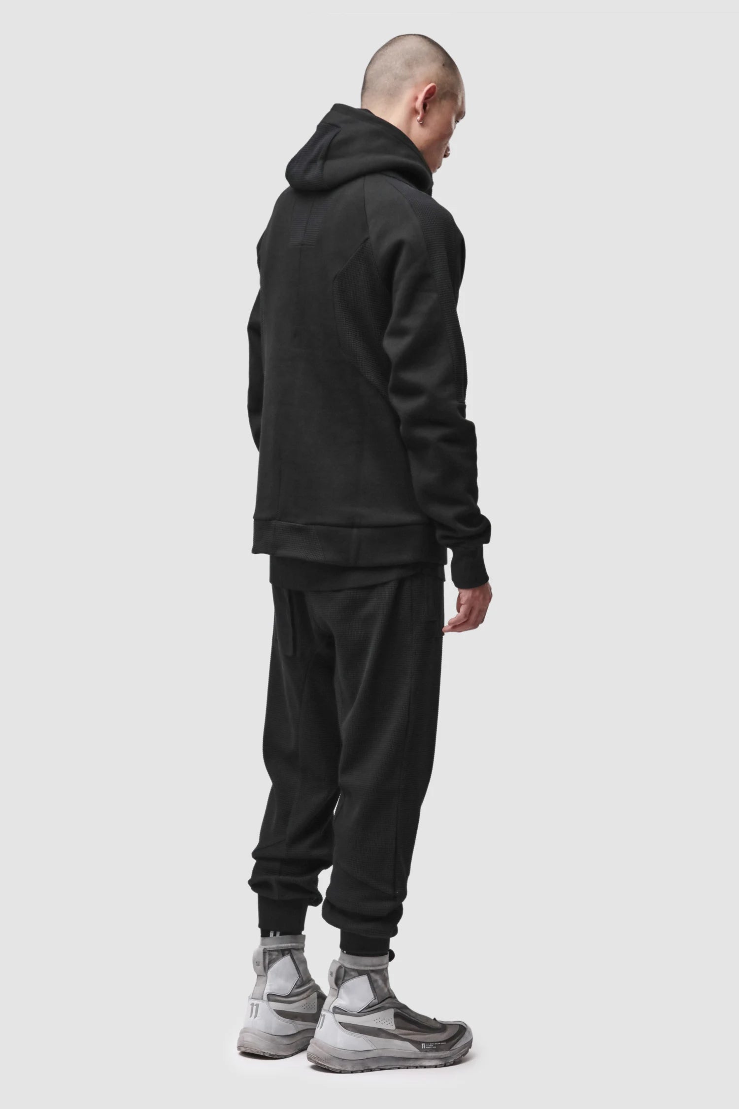 Thom Krom - Men’s Black Waffle Cotton Cargo Trousers M-ST-537 model full side view Thom Krom - Men’s Black Waffle Cotton Cargo Trousers M-ST-537 model full side view