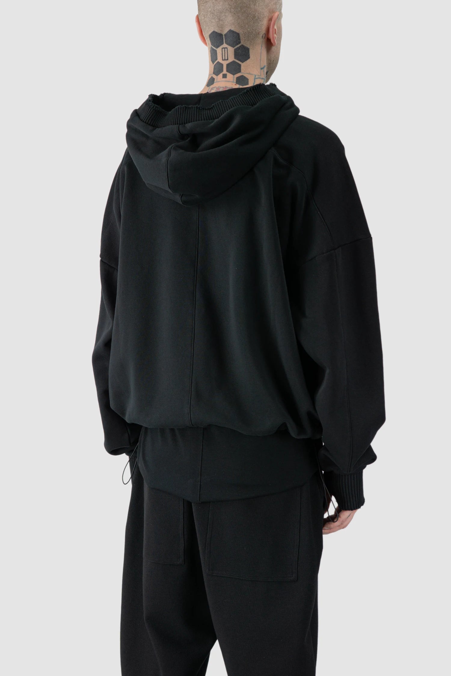 Thom Krom - model back side view of black Cropped Cotton Hooded Sweater - M-S-186