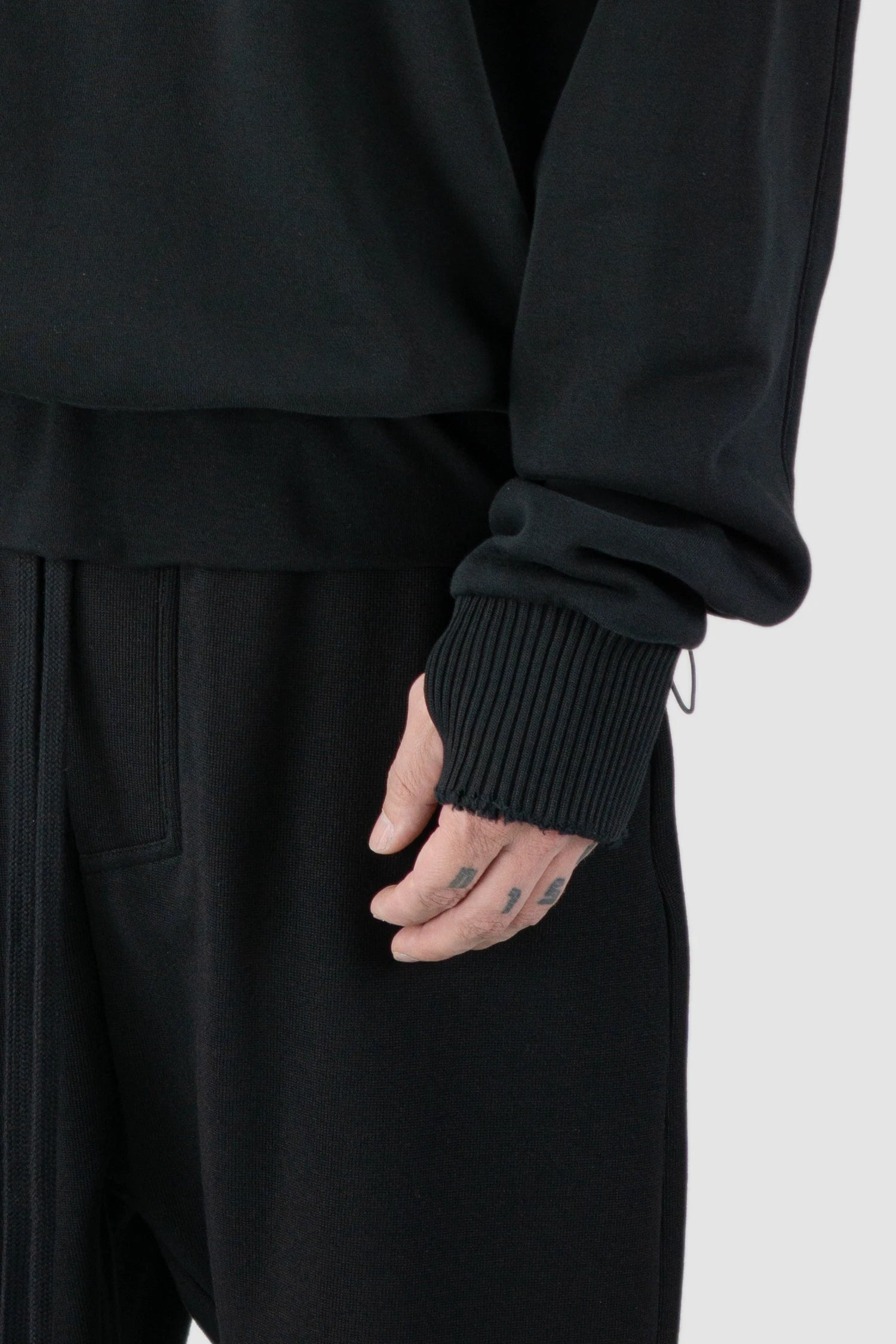 Thom Krom - model front detail view of black Cropped Cotton Hooded Sweater - M-S-186