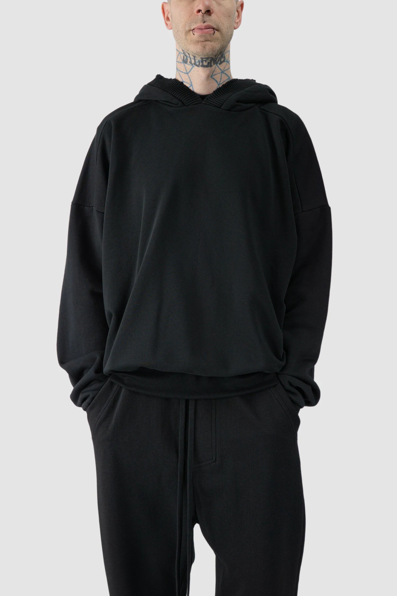 Thom Krom - model front relaxed view of black Cropped Cotton Hooded Sweater - M-S-186
