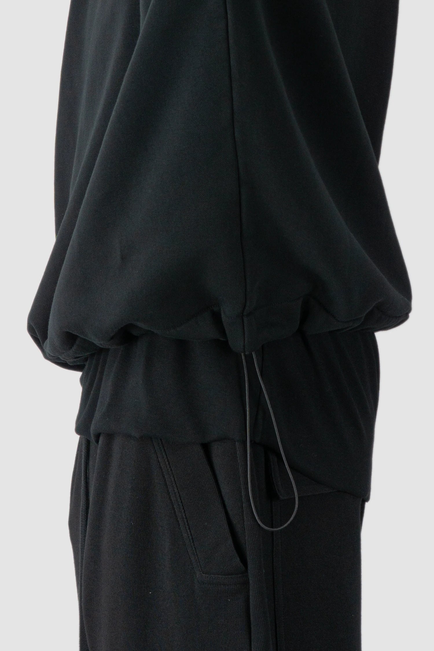 Thom Krom - model side detail view of black Cropped Cotton Hooded Sweater - M-S-186