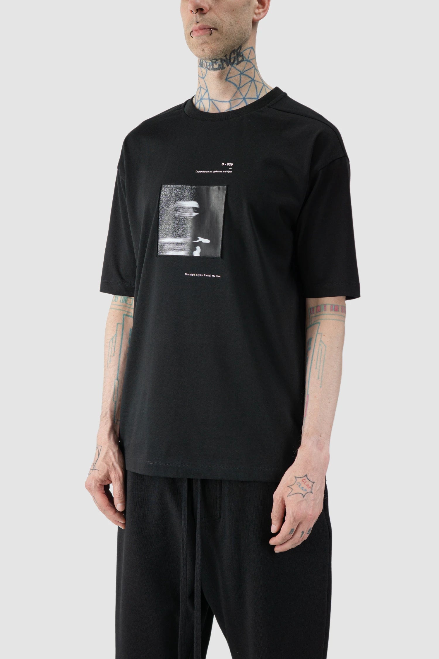 Thom Krom - model front side view of black Loose Fit Cotton T-Shirt with Patch - M-TS-876